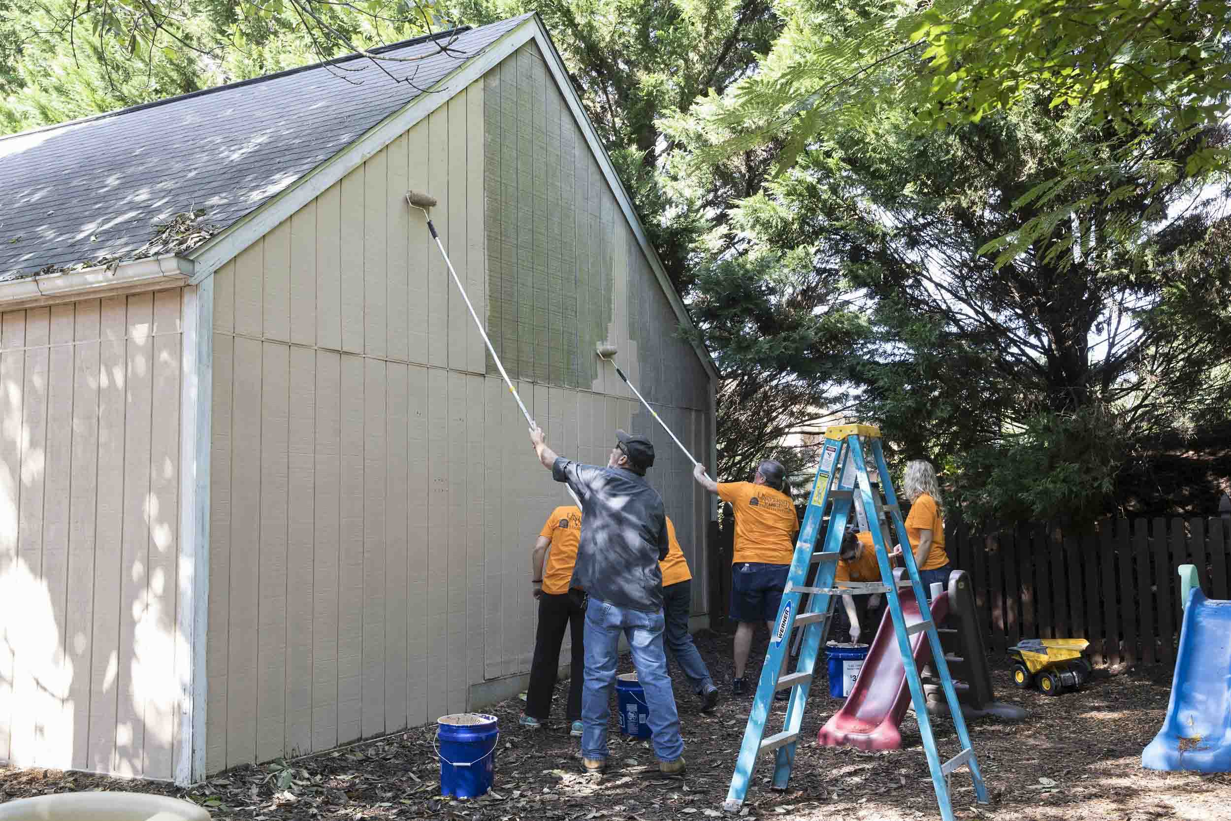 UVA Children's Hospitals pediatric surgery team paints a building together