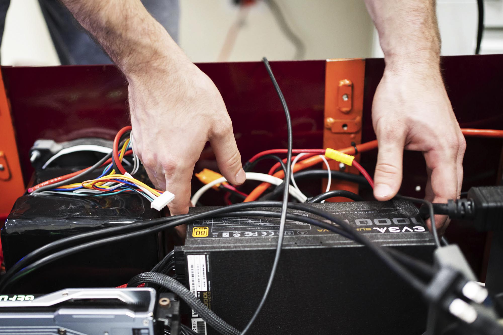 Person placing a battery in a robot