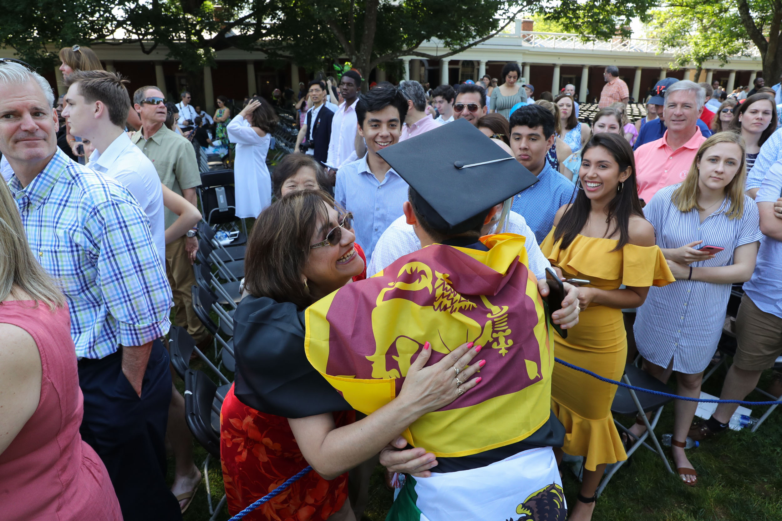 Graduate hugs family