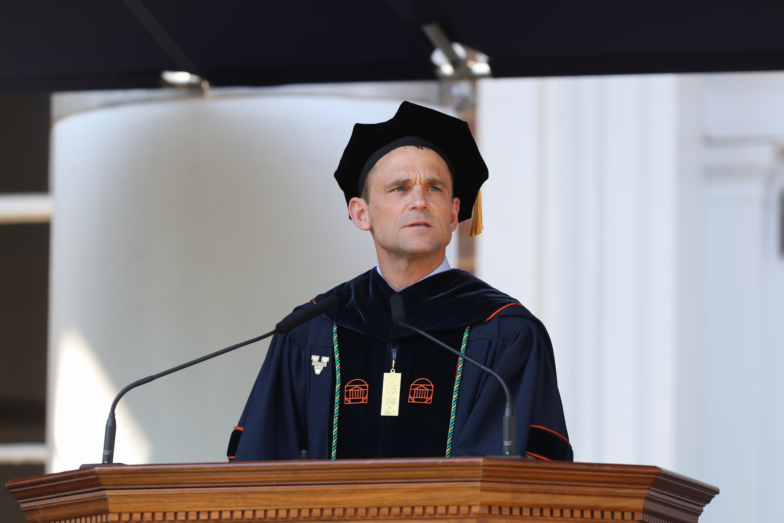 President Jim Ryan talking at a podium during graduation