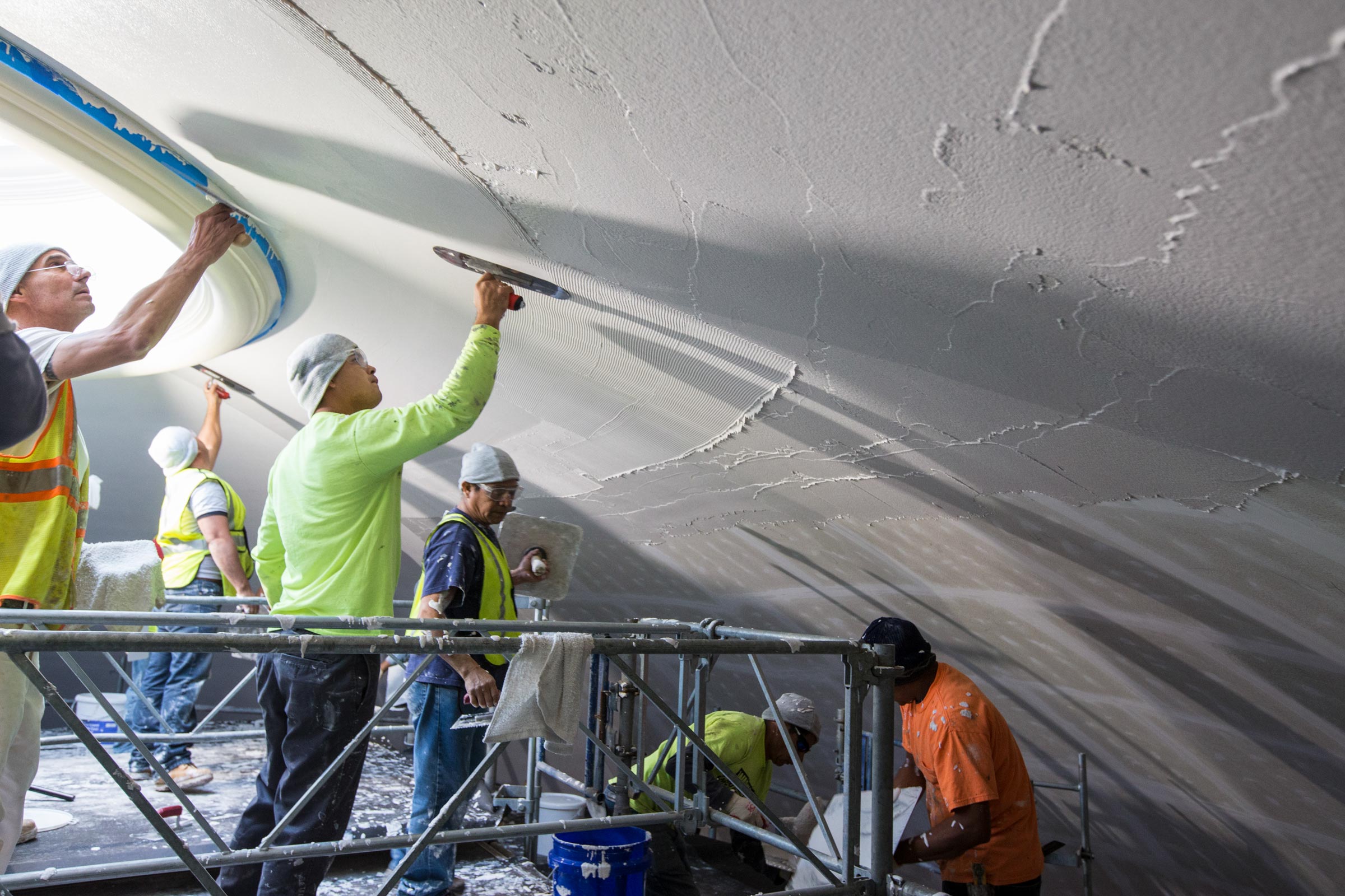 Workers applying plaster to the Rotunda Dome