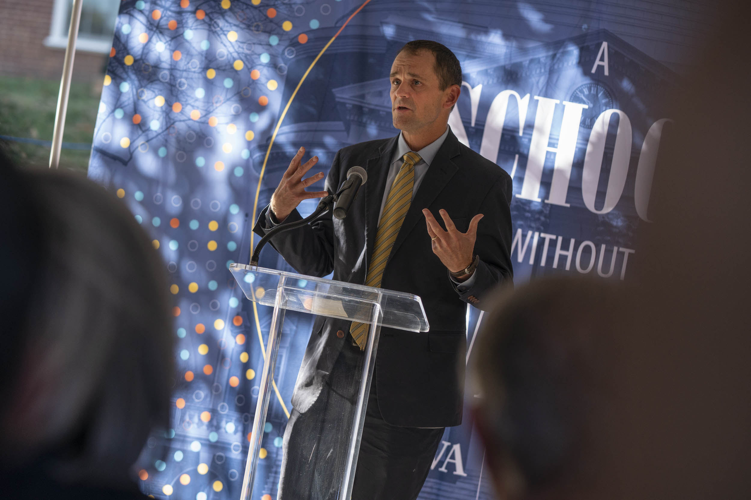 President Jim Ryan standing at a podium giving a speech