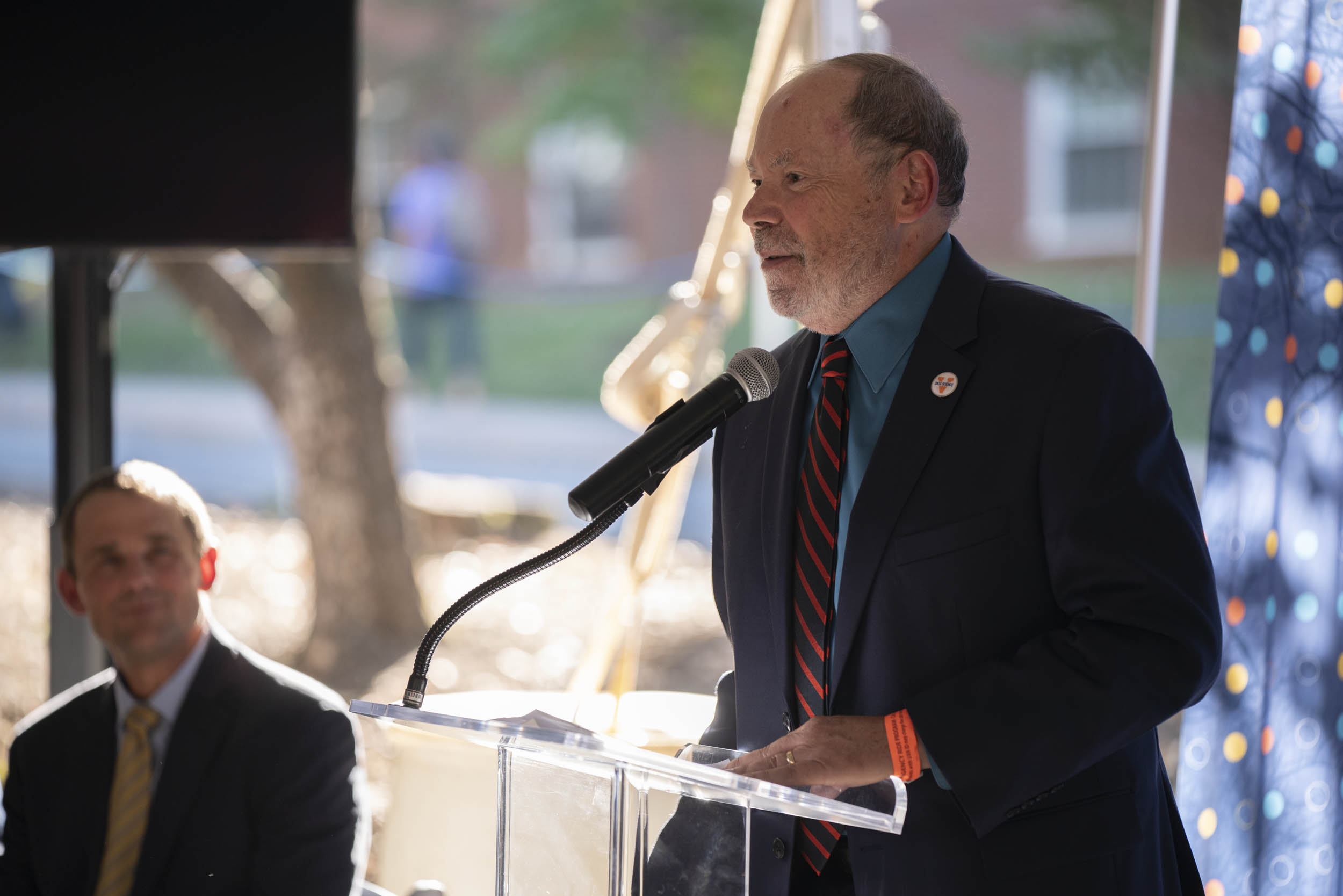 Dean Philip E. Bourne giving a speech at a podium