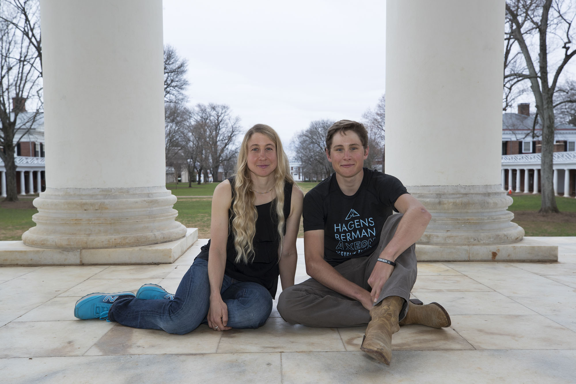 Dvorak, left, and Anderson, right, sit on the Rotunda stone smiling at the camera