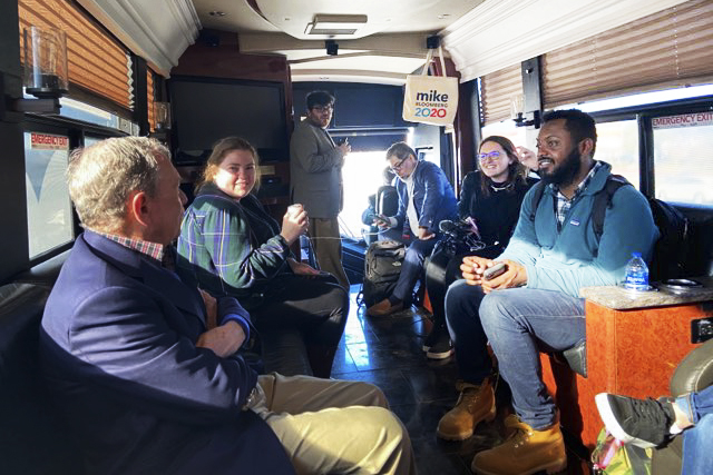 Tim Perry interviewing a political candidate on the campaign trail