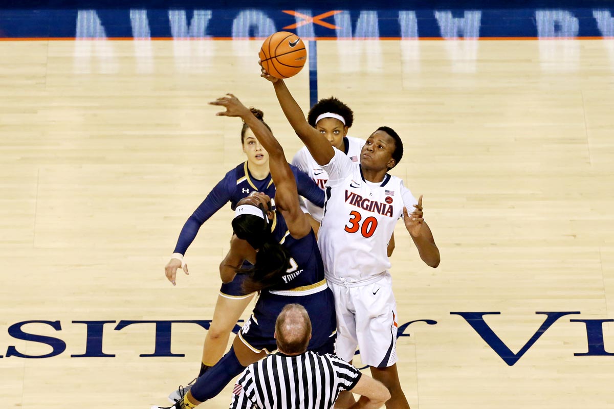 Felicia Aiyeotan jumping up to grab the ball at the start of game