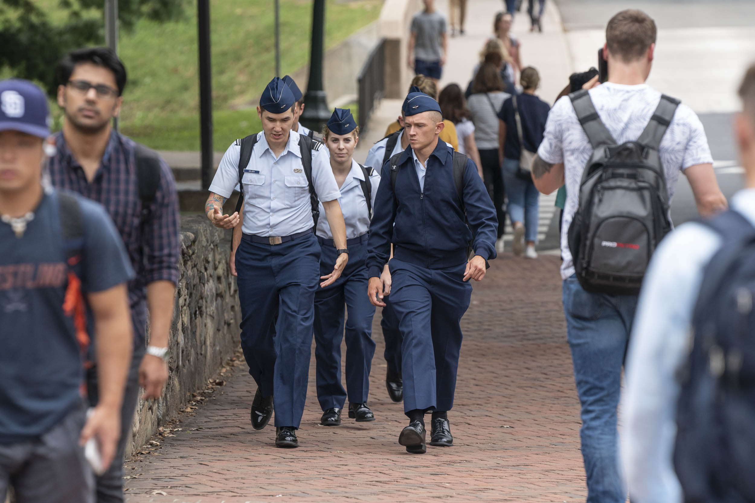 ROTC Air Force Cadets walking on a sidewalk on grounds