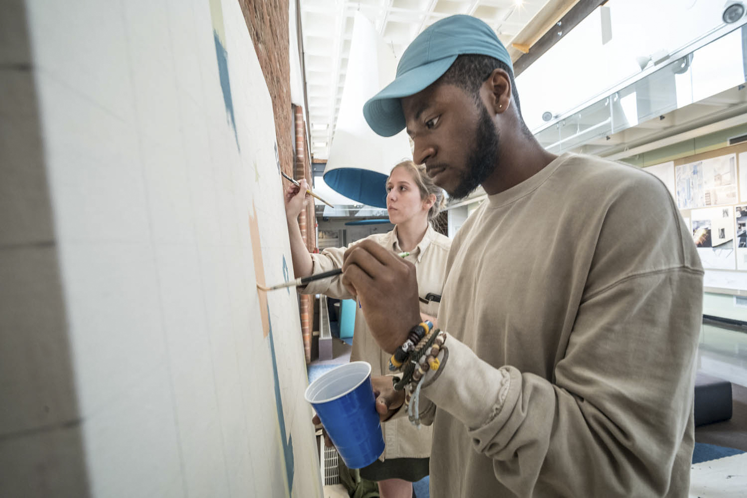 Students, faculty members and community members worked on the flag painting 