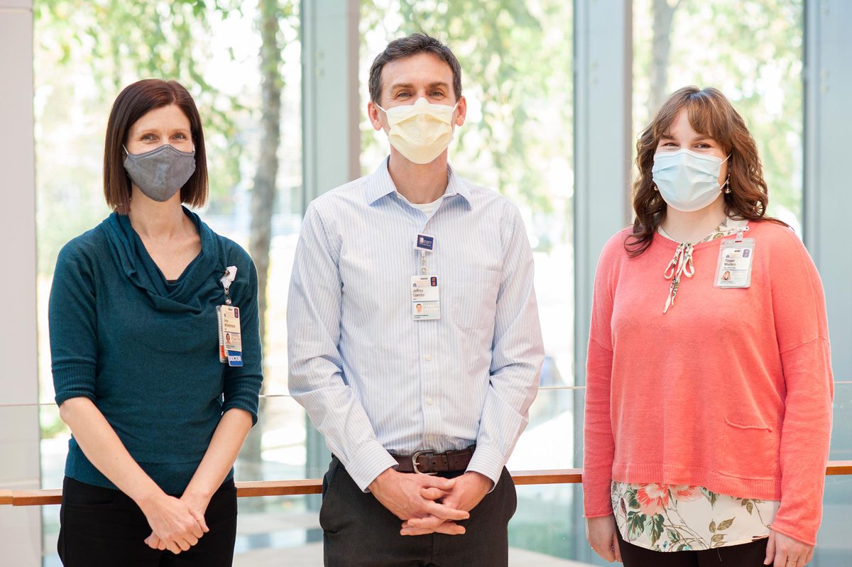 Dr. Jeffrey Gander,center, Dr. Amy Wrentmore, left, Tegan Medico, right, stand together for a picture