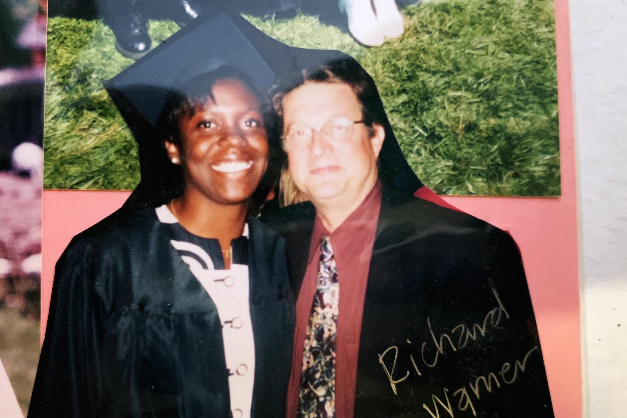 Richard Warner, right, standing with Forjindam at graduation