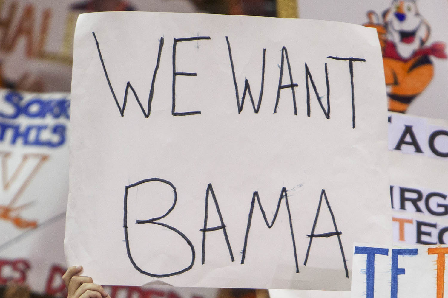 Sign reading "We Want Bama" 