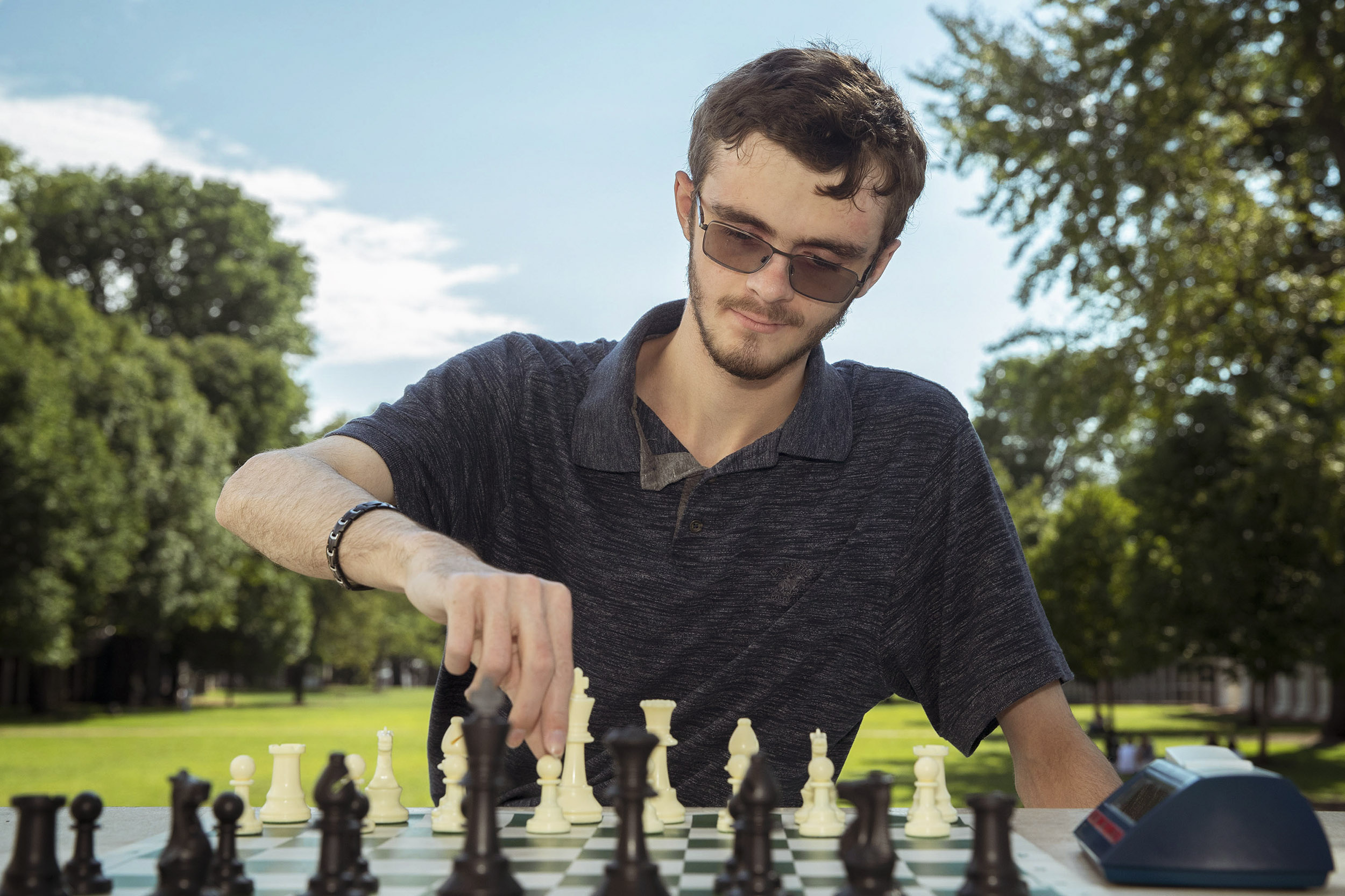 Jason Morefield playing chess on the Lawn