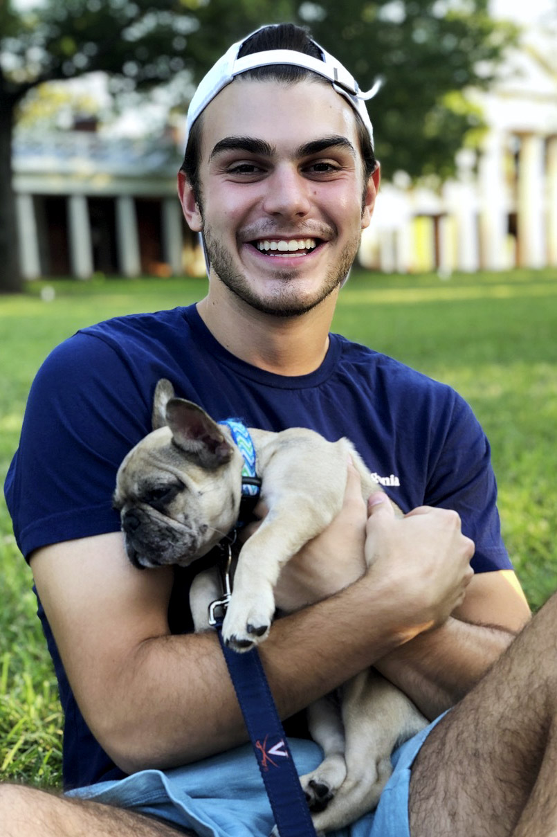 Shapiro holding his dog on the Lawn
