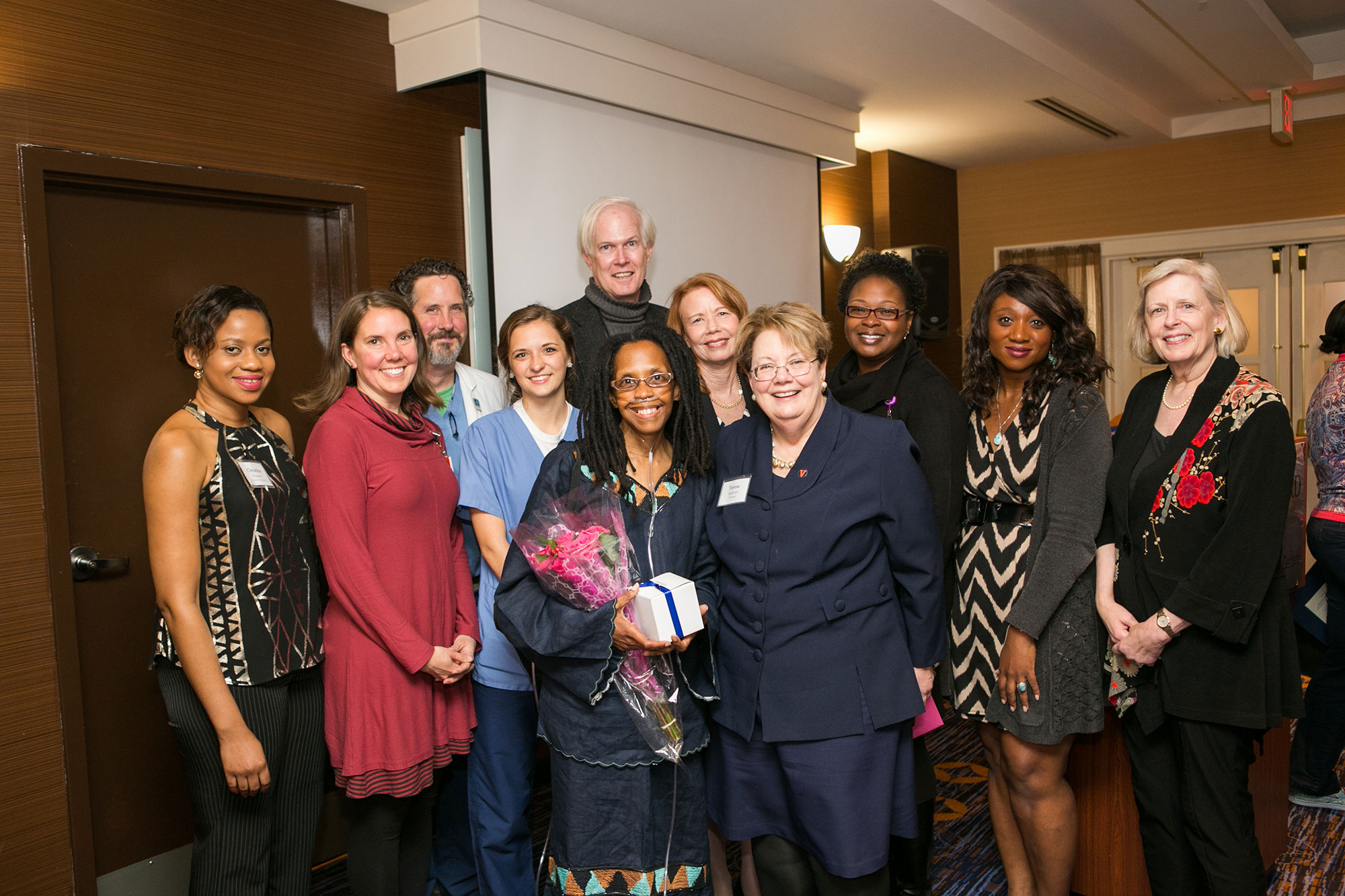 Nursing Ph.D. student Holly Edwards, front left, stands with UVA President Teresa A. Sullivan, front right, and colleagues after receiving UVA’s first Excellence in Graduate Diversity Award.