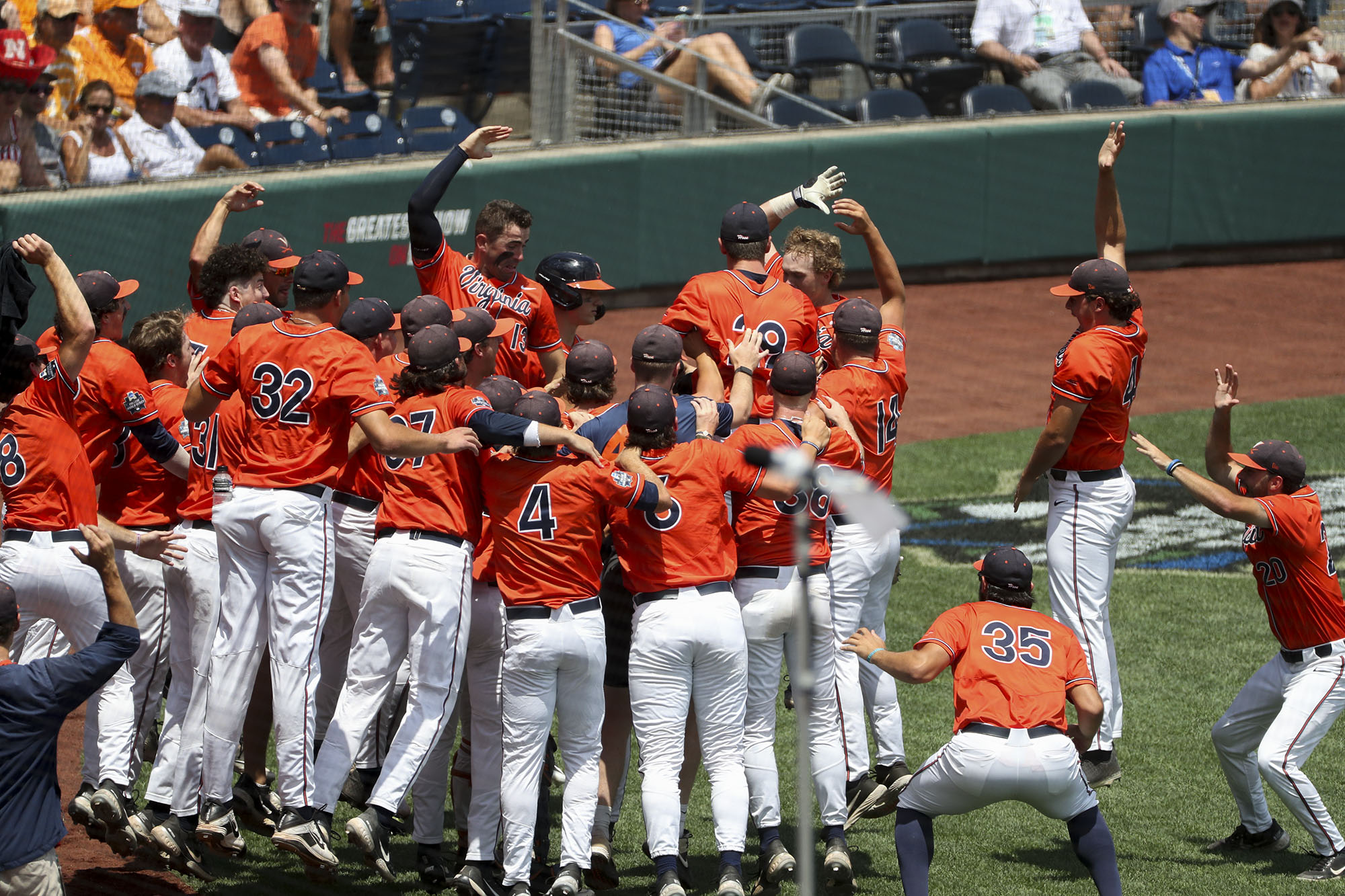 UVA baseball team jumps in at home plate after victory 