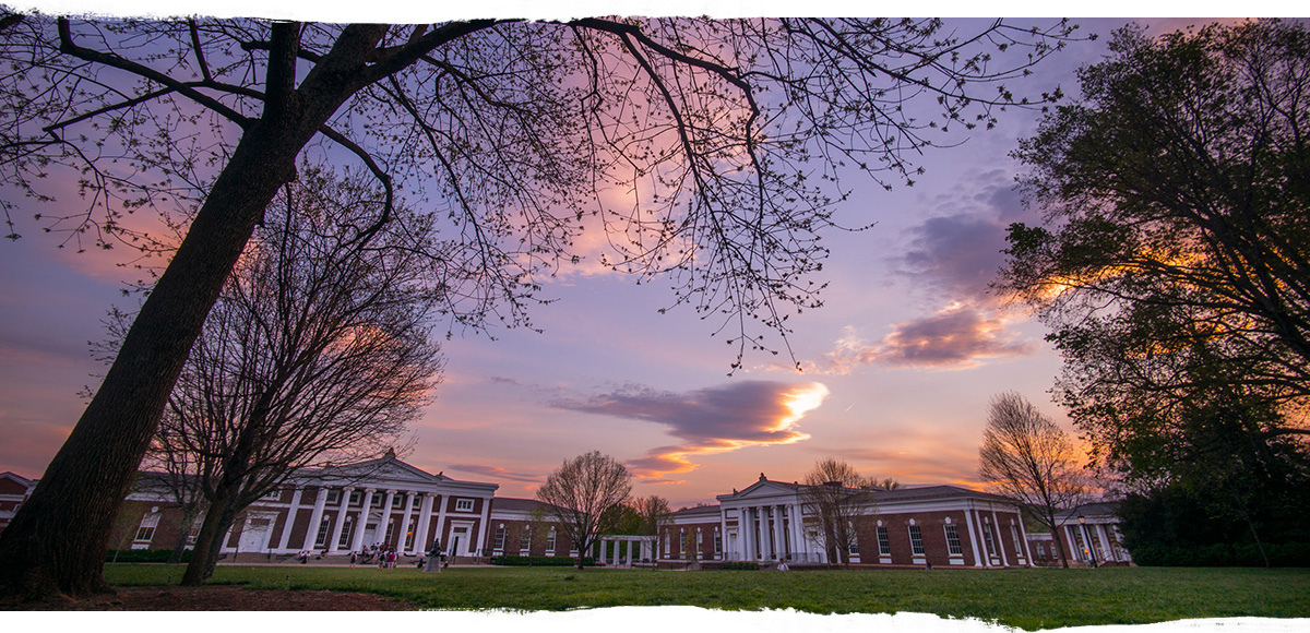 Orange and purple sunset over the UVA buildings