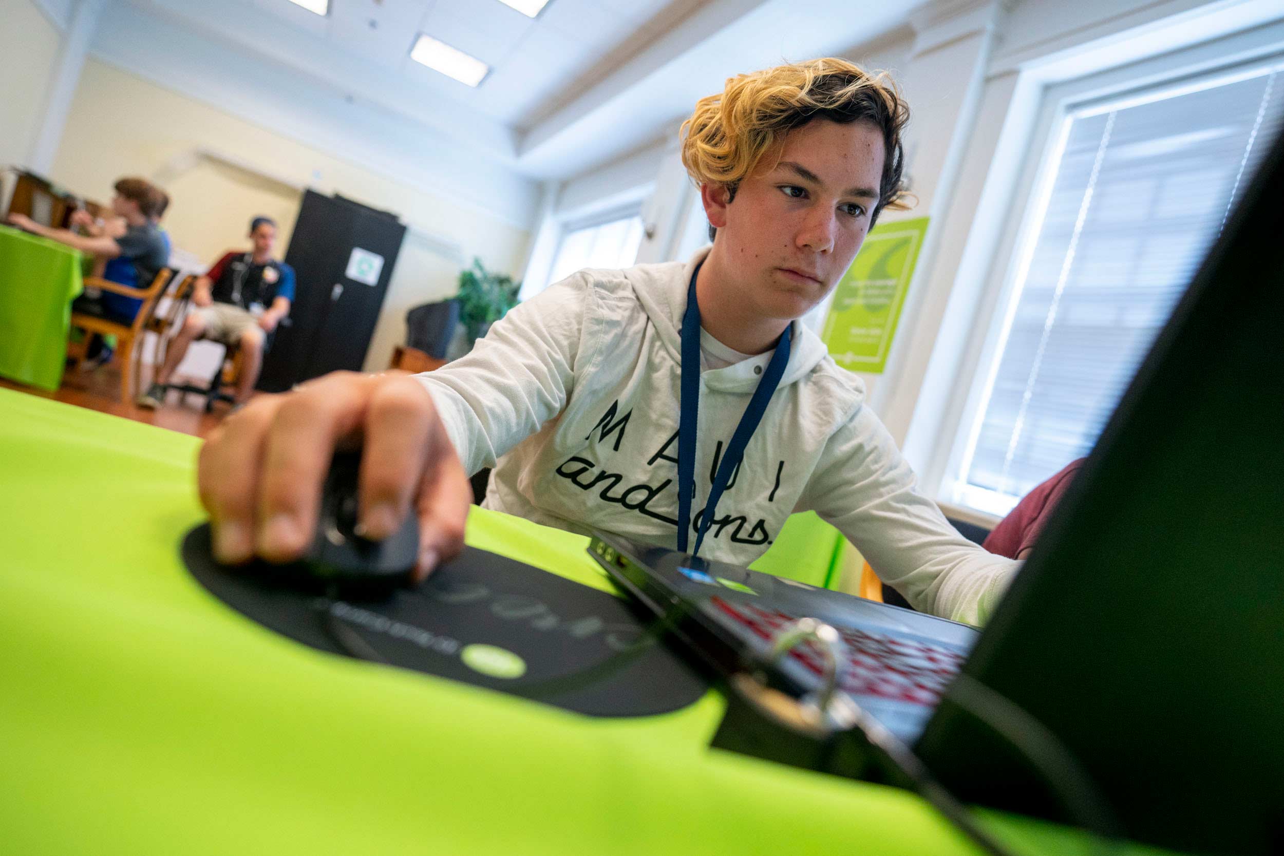 James Clayton designs a game last month in a classroom in Shea House. (Photo by Sanjay Suchak, University Communications)