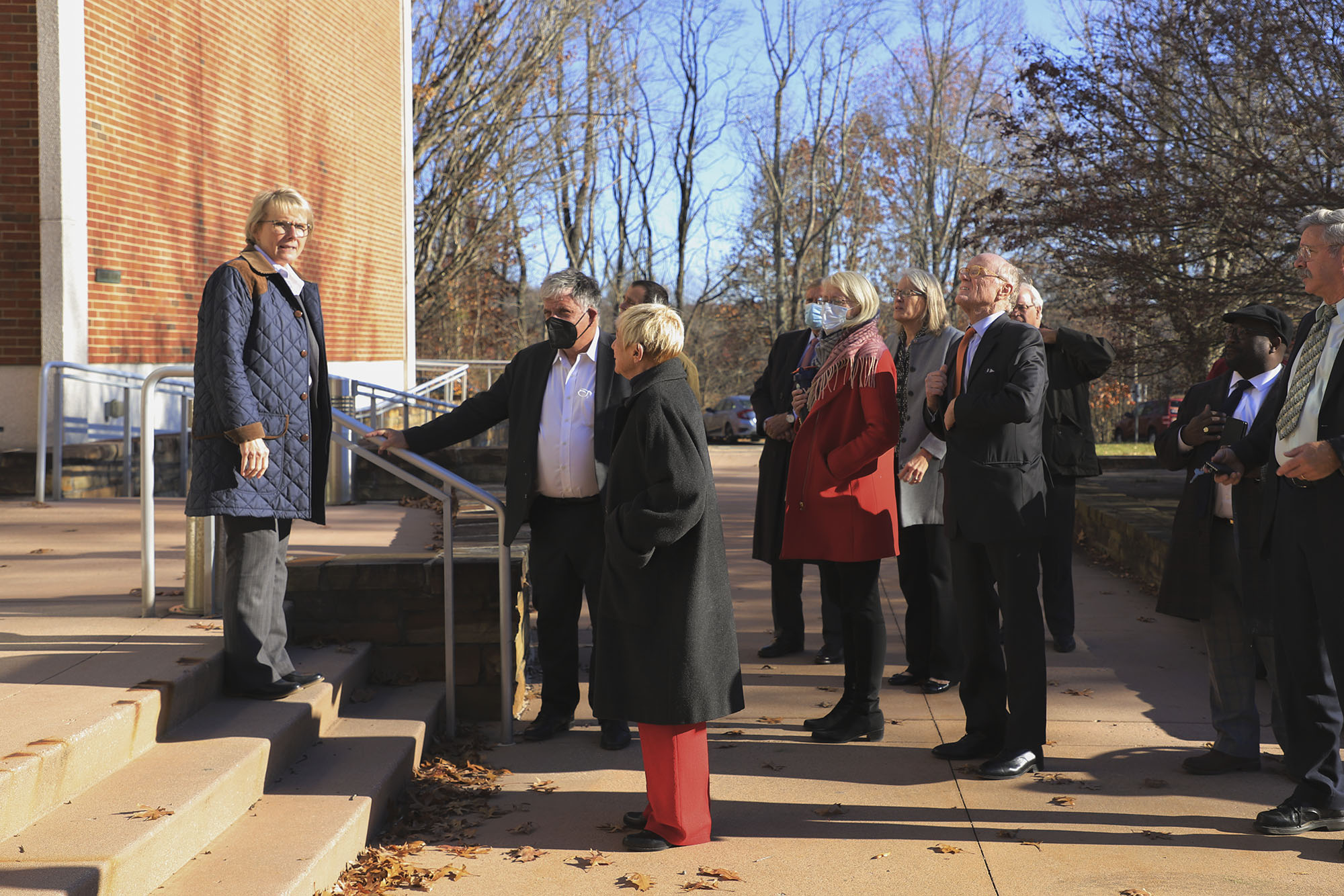 Donna P. Henry on the steps of wise talking to a group of people