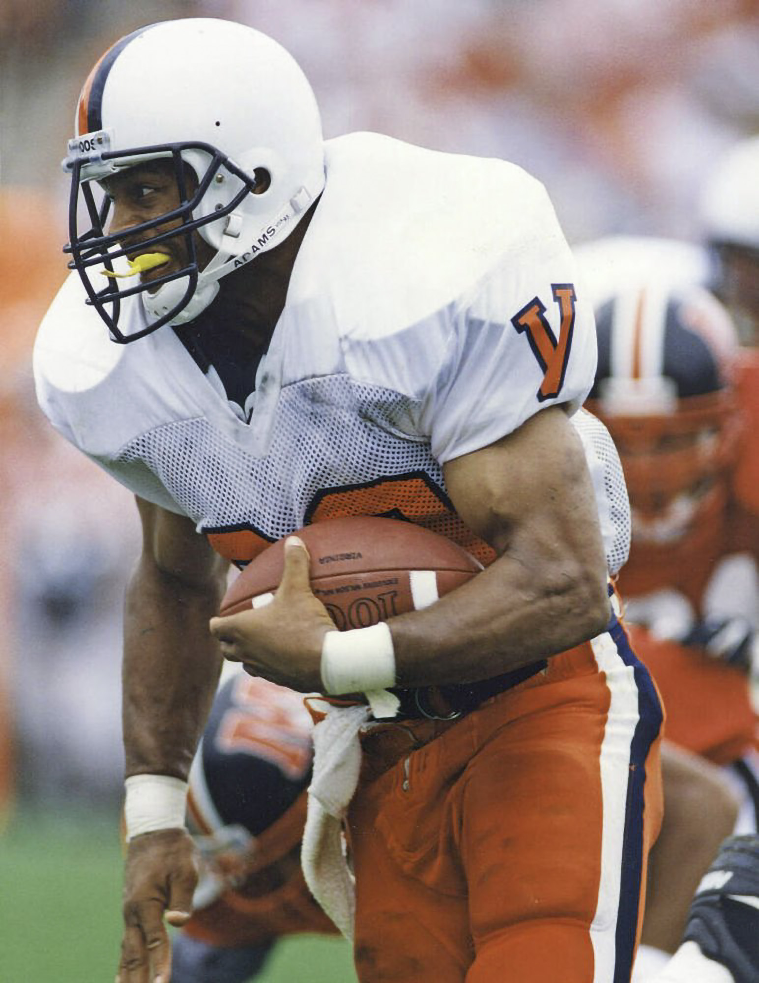 Charles Way holding the ball as he makes a play