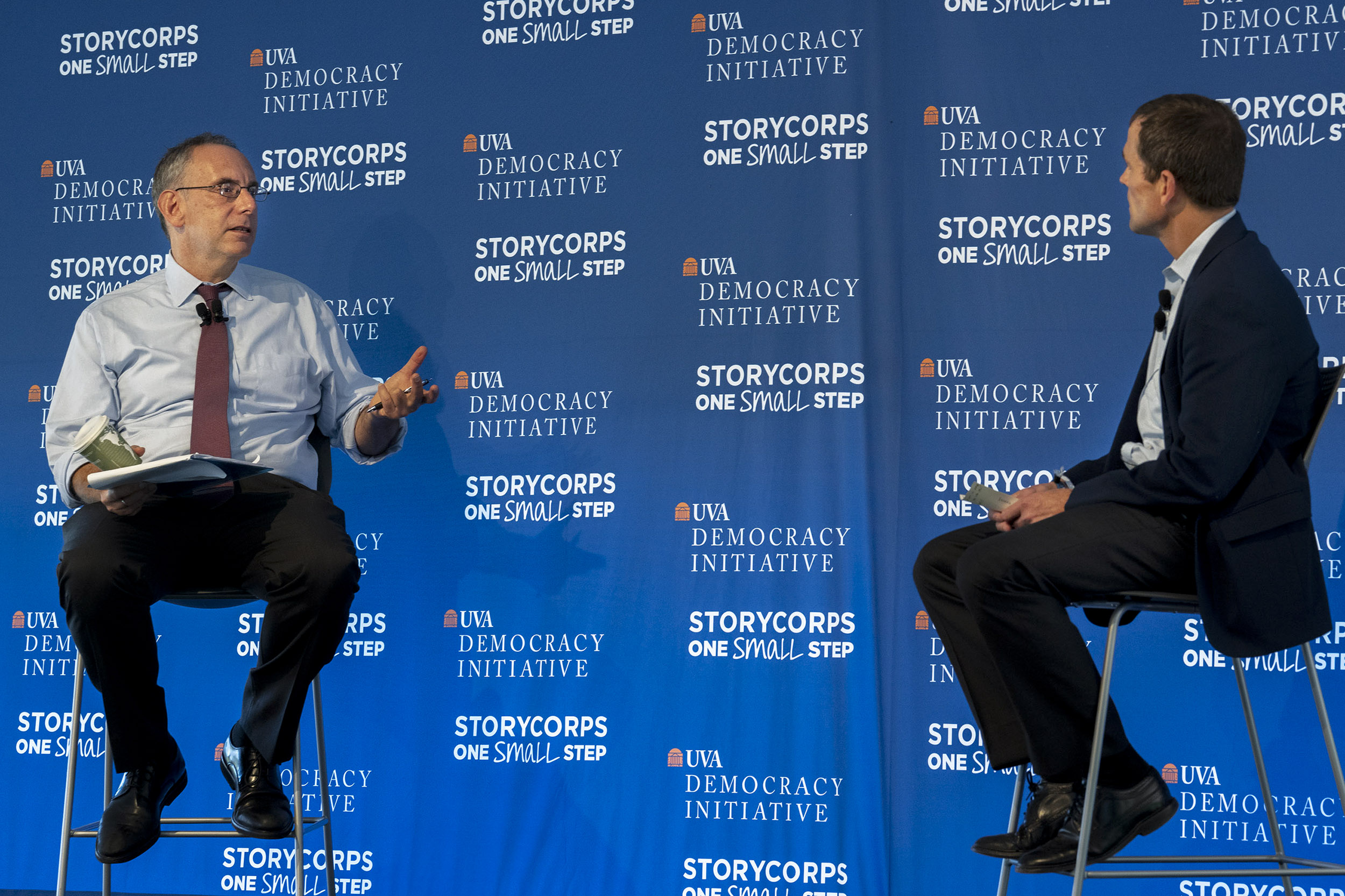 President Jim Ryan (right) speaking to another man on the UVA democracy Initiative stage