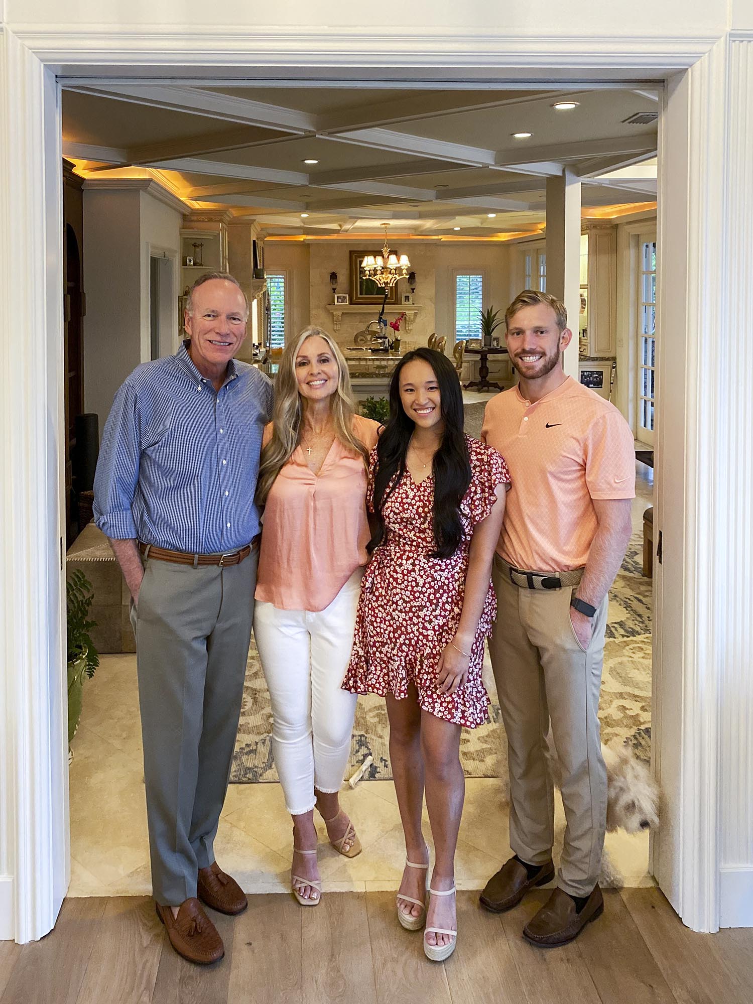 Stanger family standing for a photo together in their home