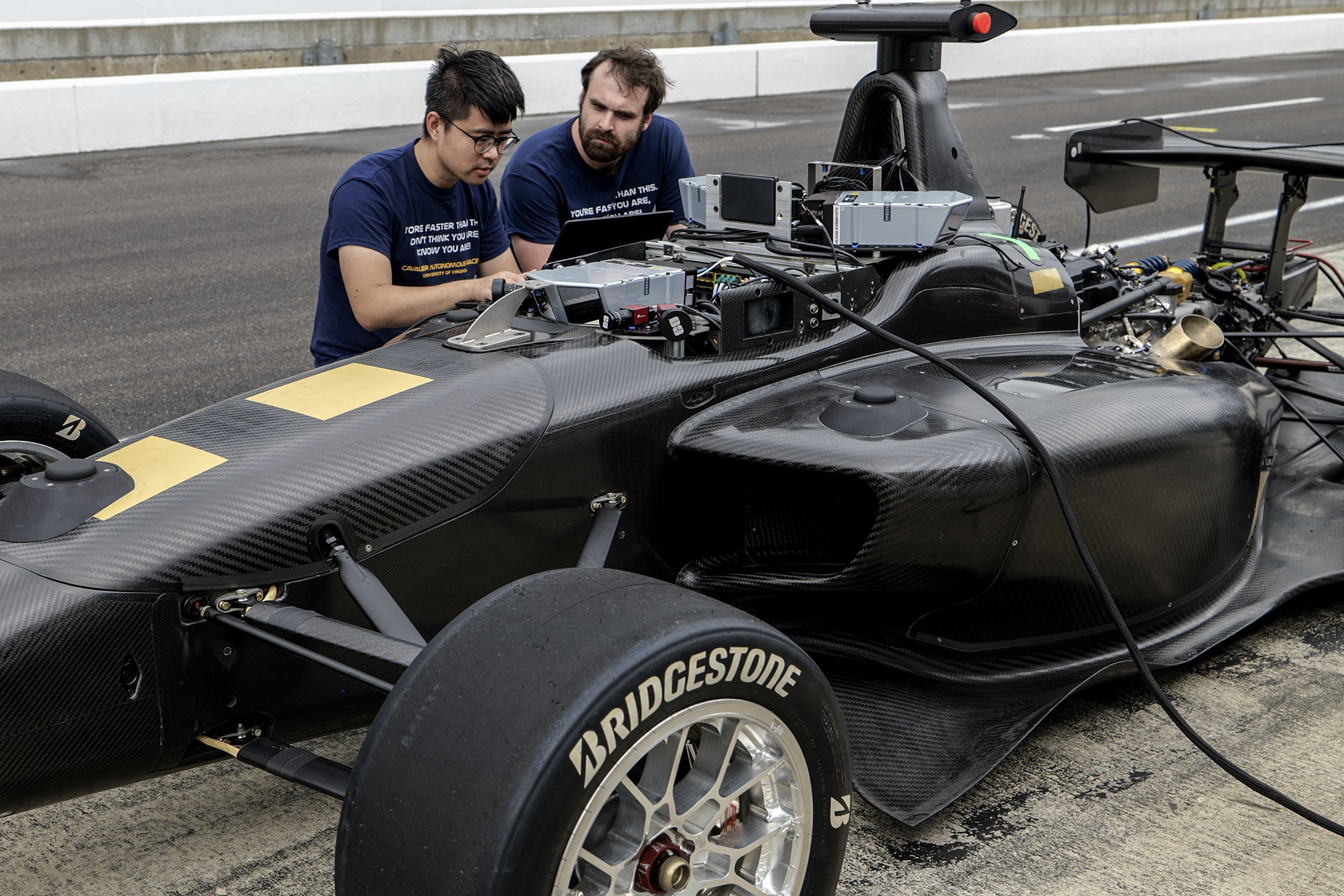 UVA Autonomous racing team working on tweaking their car on the track