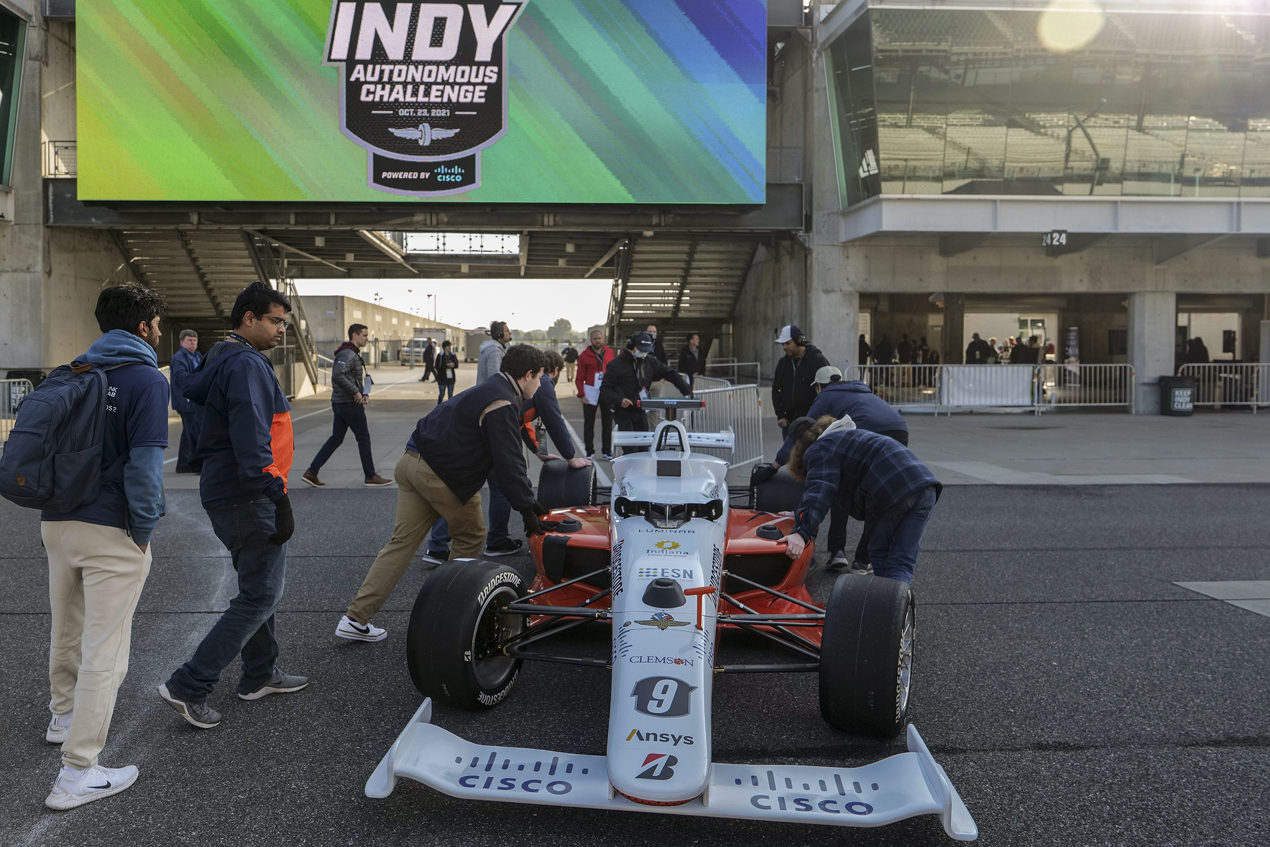 UVA's Autonomous Racing Team pushing their autonomous vehicle at the Indy Speedyway