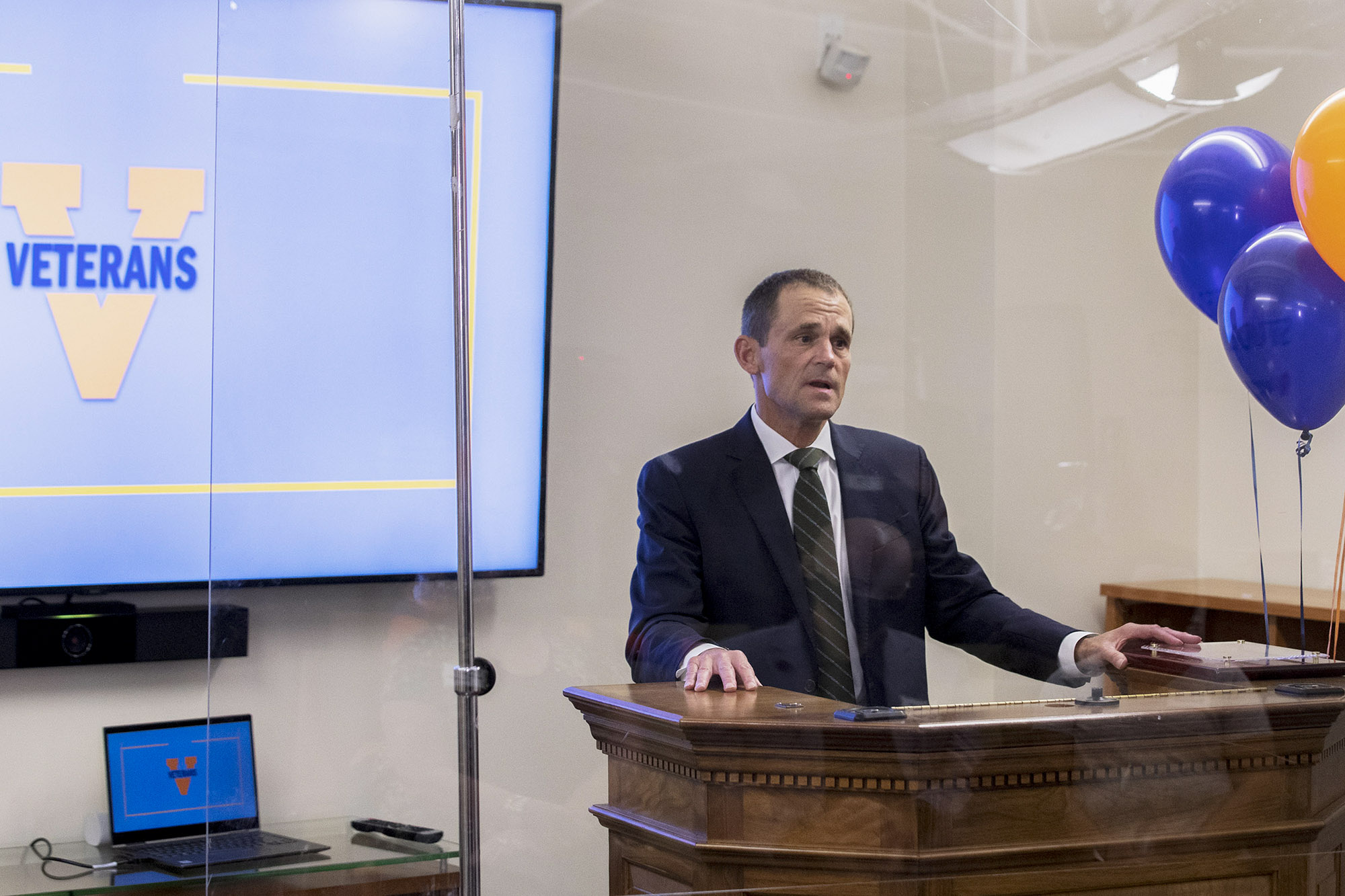 President Jim Ryan standing at a podium giving a speech