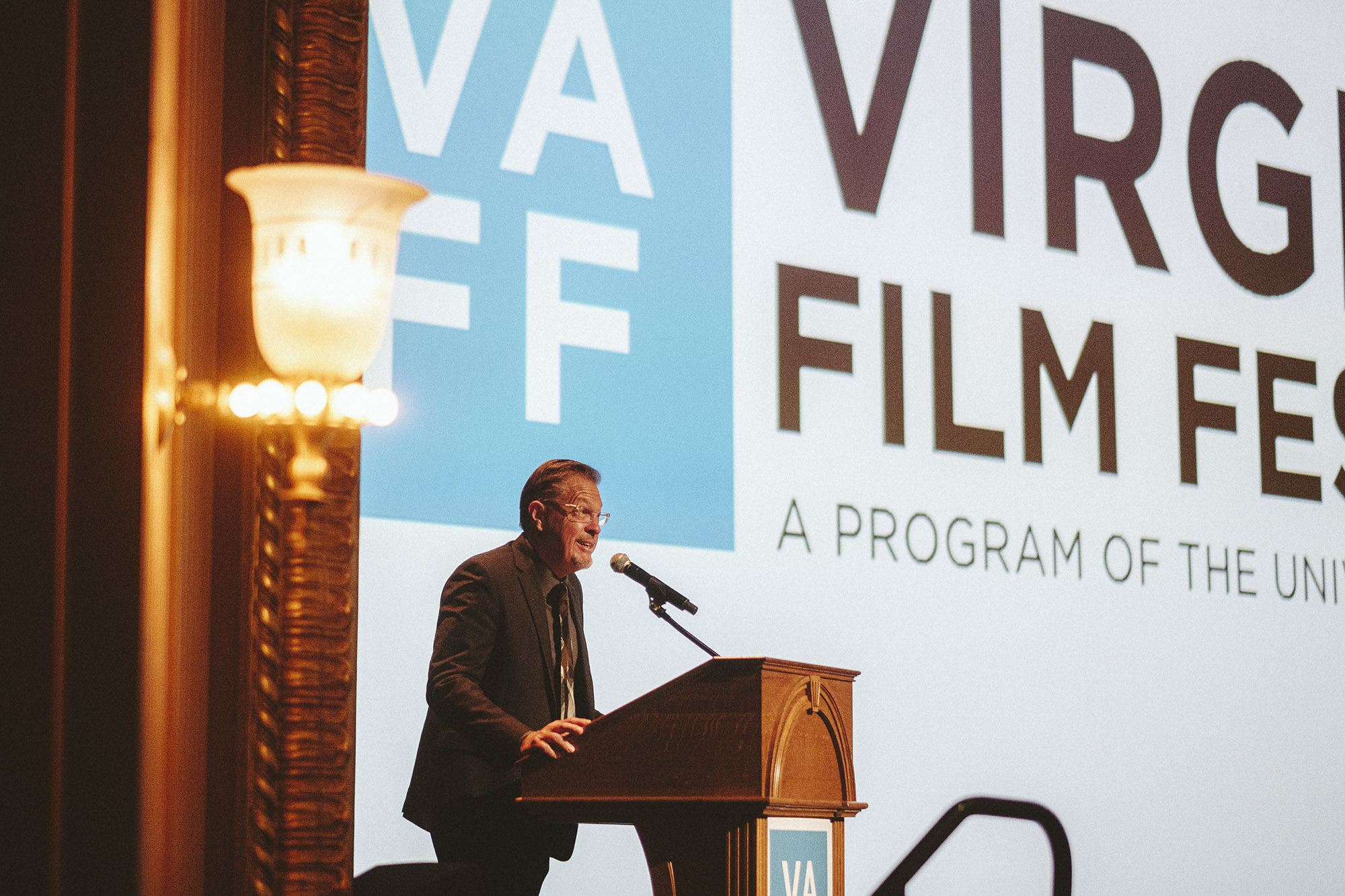 Jody Kielbasa speaking at a podium at the Virginia Film Festival