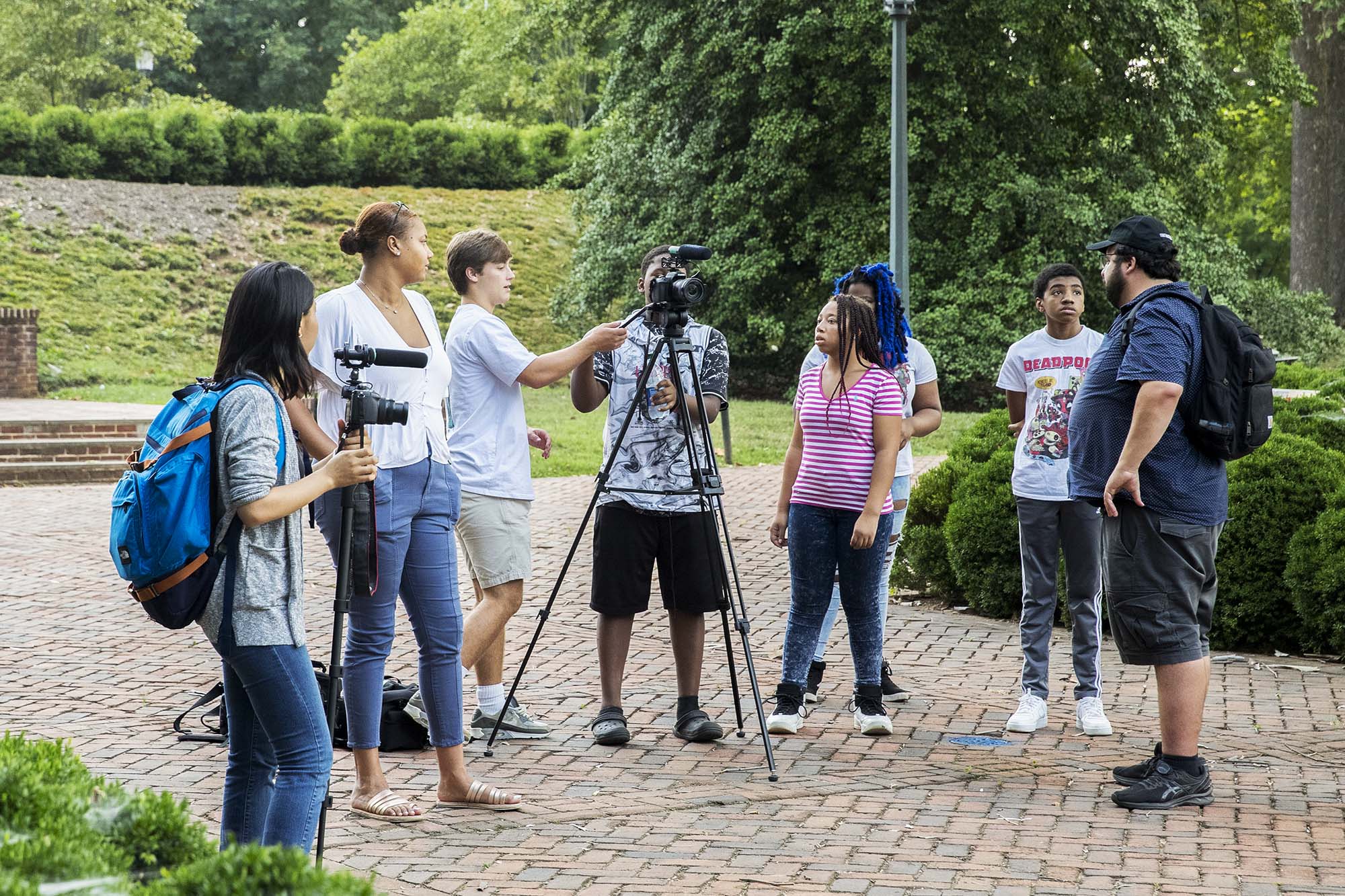 Group of students with cameras working together