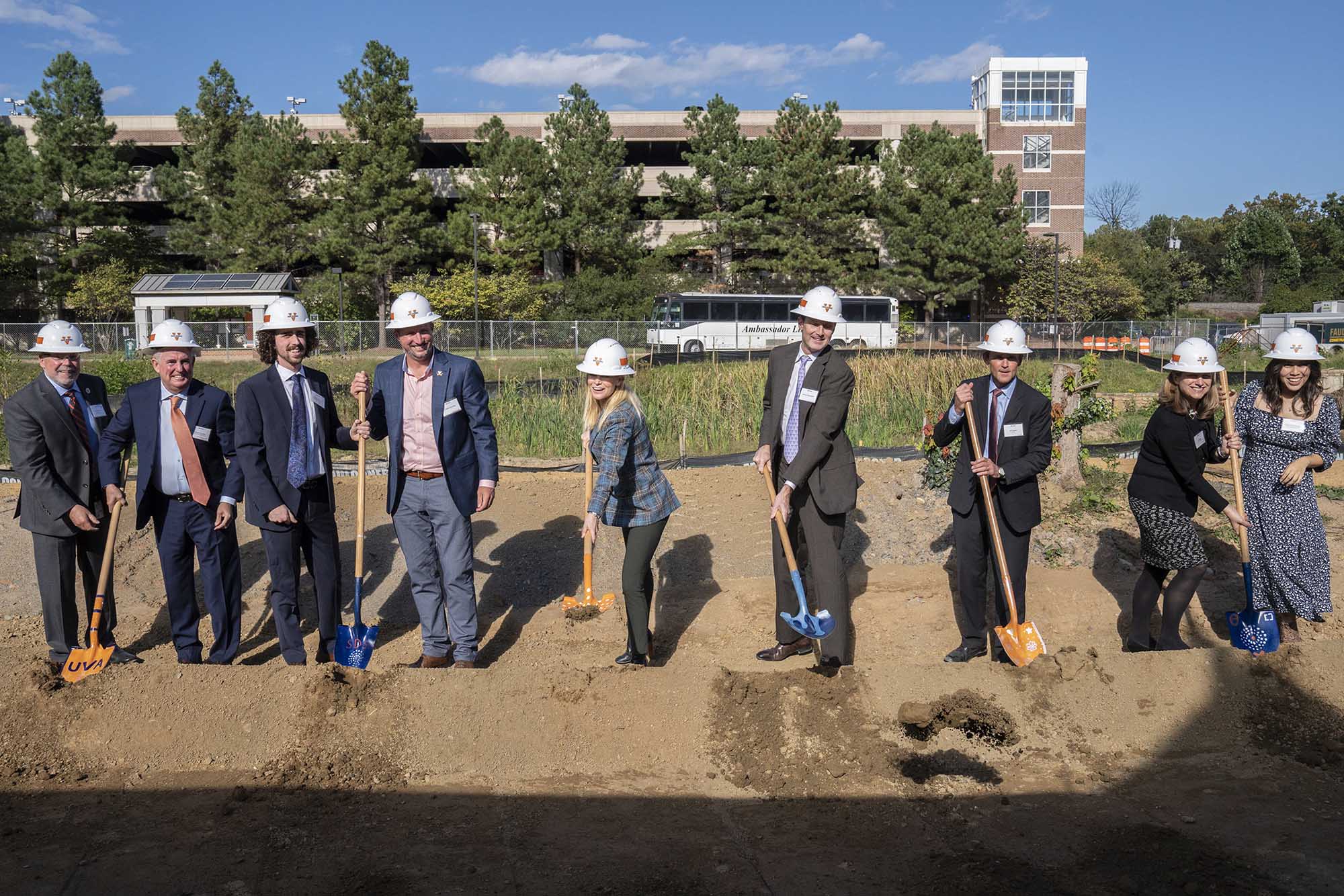 University Officials wearing Hard hats and shovels break ground on the data Science Development project