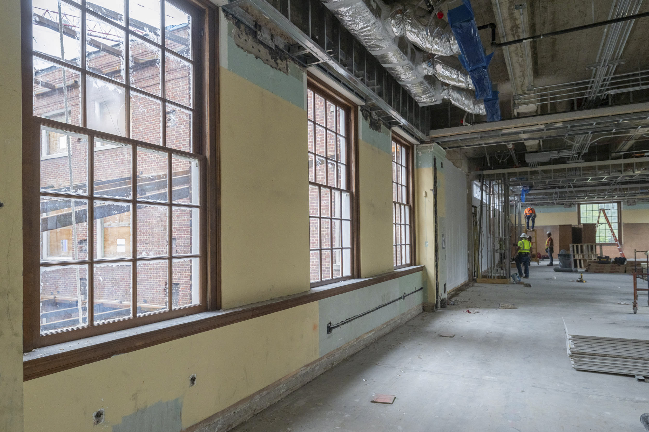 Inside the gutted Alderman Library with Construction workers working