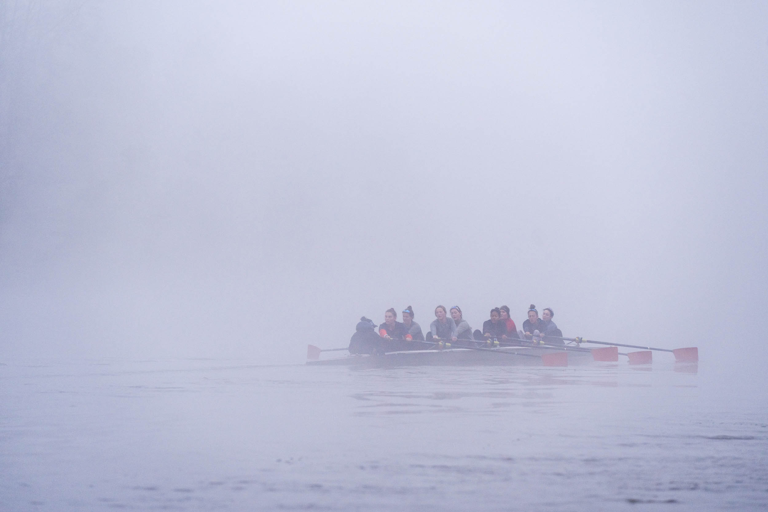 UVA Rowing team on a foggy river