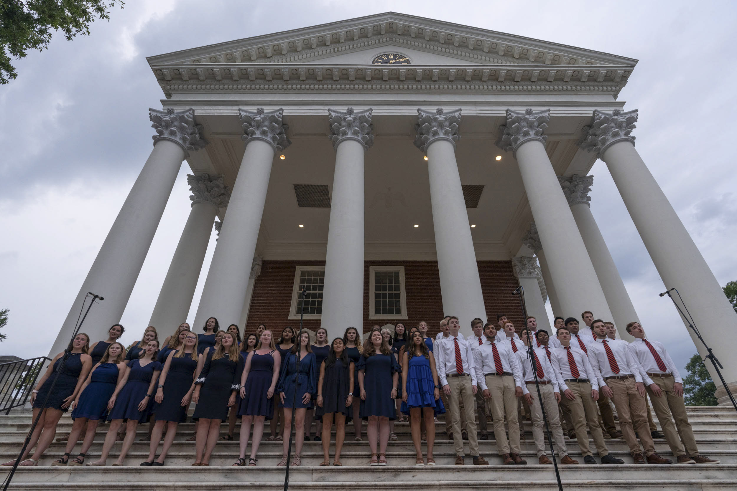 The University Singers stand on the steps of the Rotunda signing