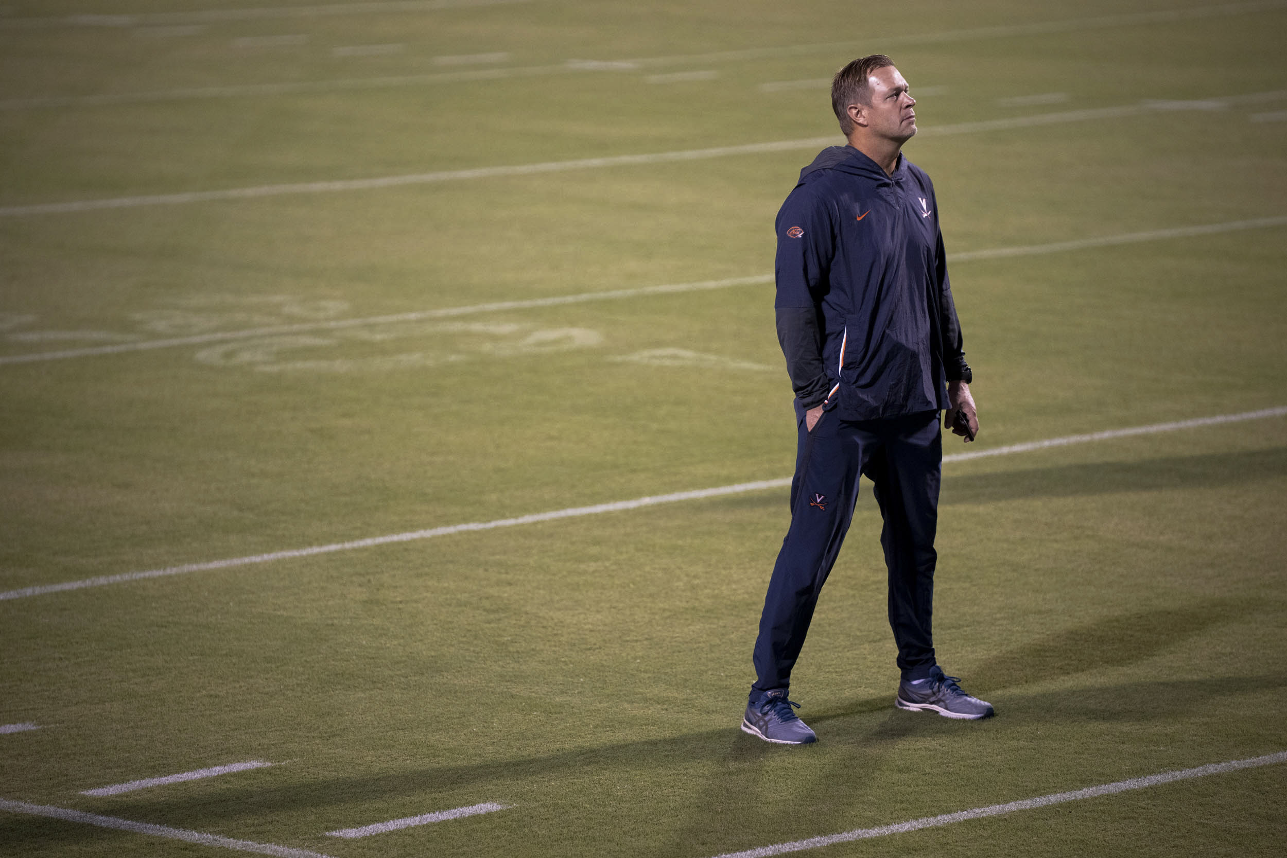 Mendenhall stands on the football field