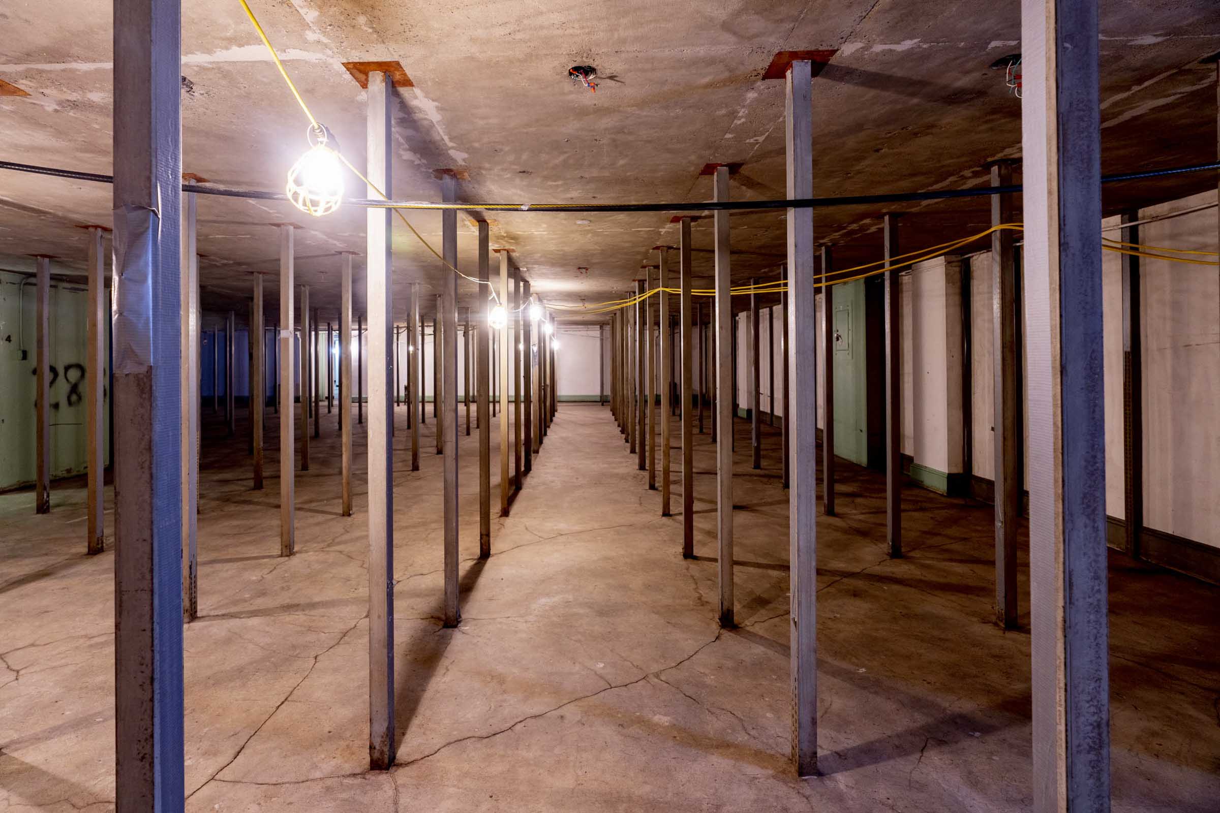 Alderman Library basement is lined with metal posts from floor to ceiling in concrete that is starting to crack