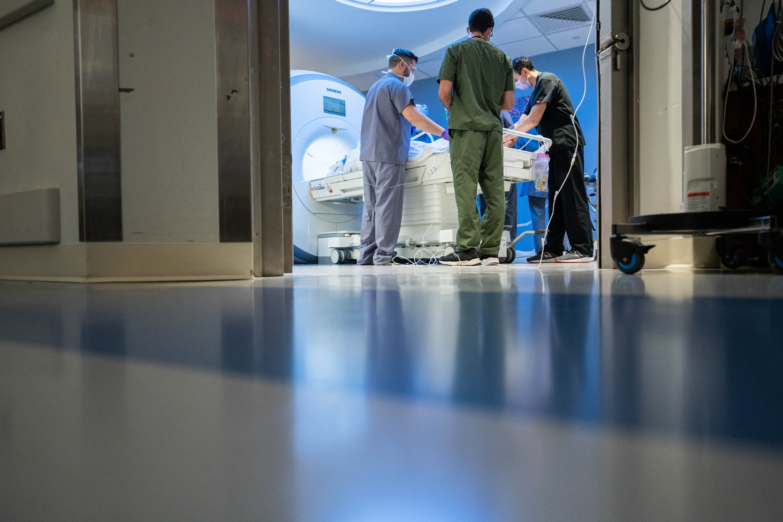 Healthcare workers preparing a patient for an mri