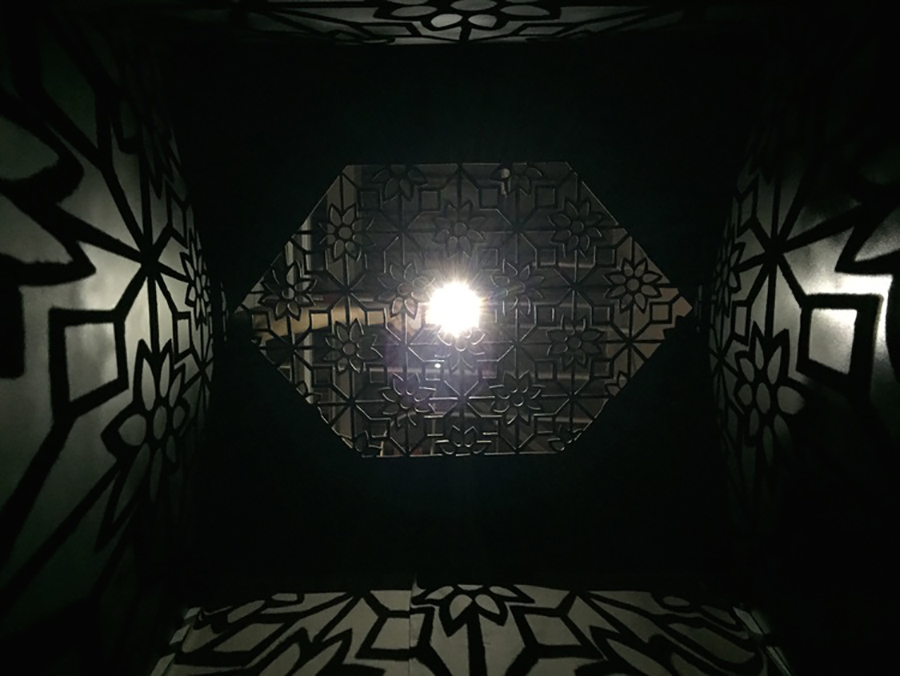 Feraidon’s installation features a steel enclosure with cutout patterns that reference traditional Islamic art. The shape of the cutout also mimics small openings in traditional burqas, from which women get their only glimpse of the outside world.