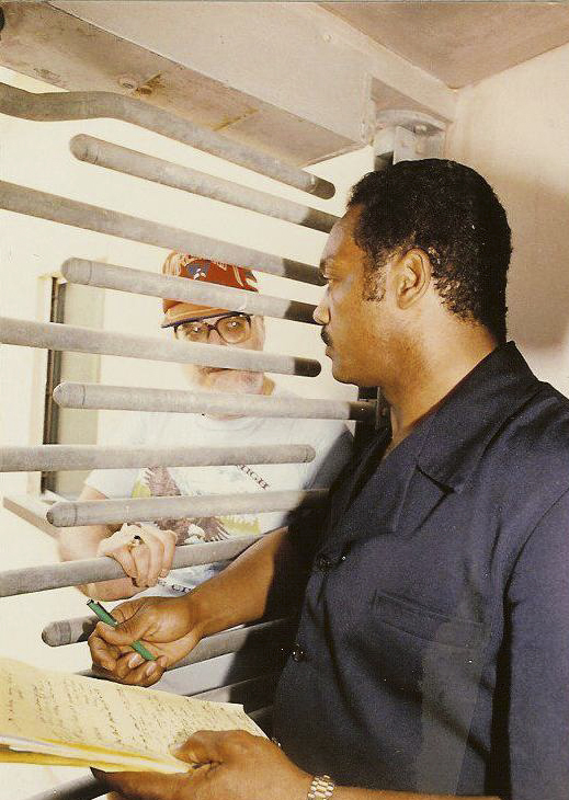 The Rev. Jesse Jackson is seen talking with Howell during a visit