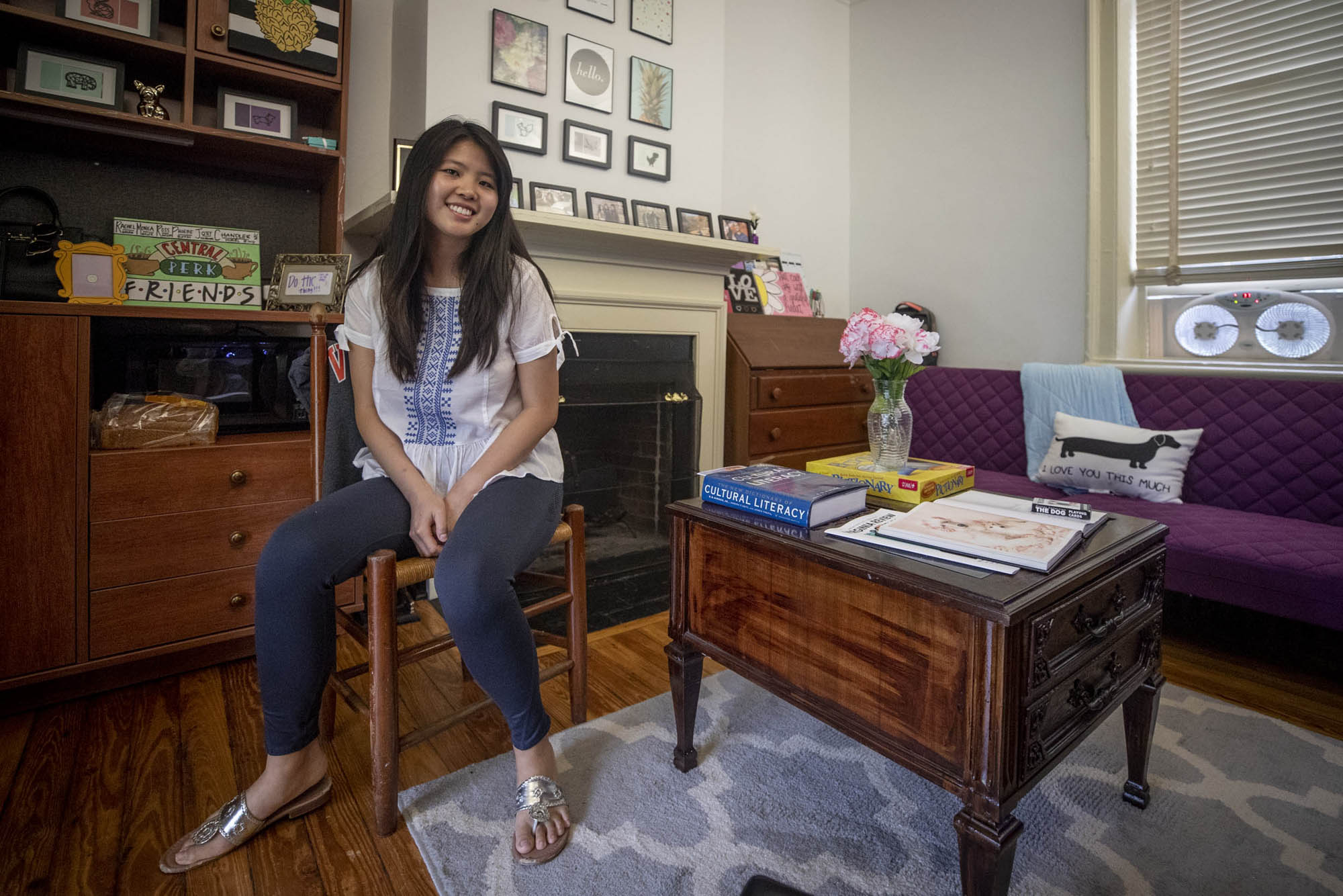 Irena Huang sitting in a chair in her room on the Lawn
