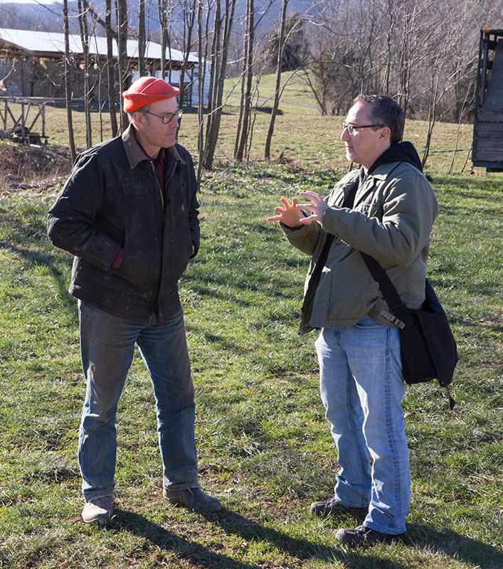 Joel Salatin (left) and University of Virginia politics professor Paul Freedman discuss the present course of agriculture at Salatin’s base of operations, Polyface Farm in Swope. Freedman brought his Politics of Food January Term class to Polyface recentl