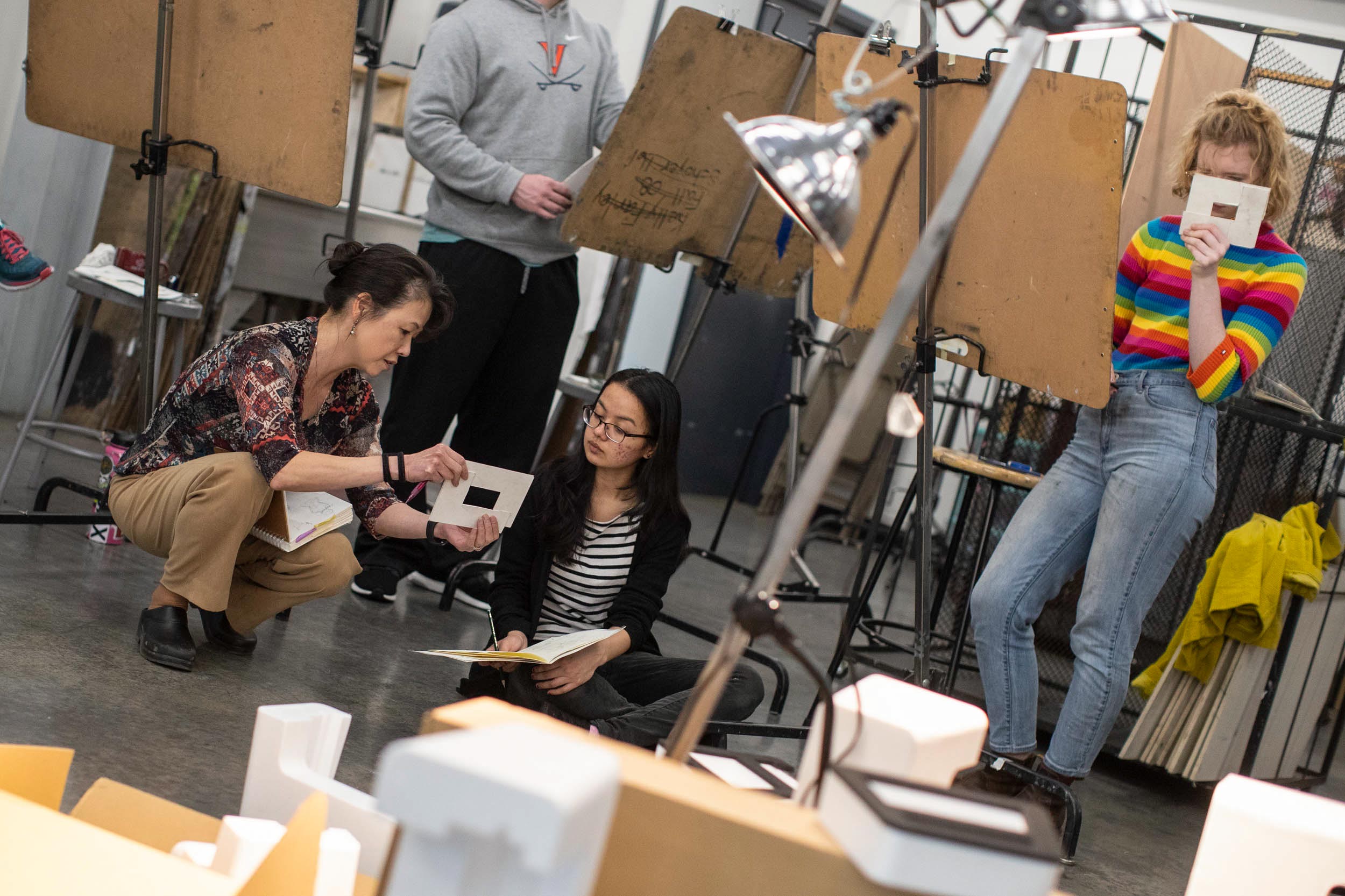 Akemi Ohira Rollando talks with Navashree Singh during her drawing class.