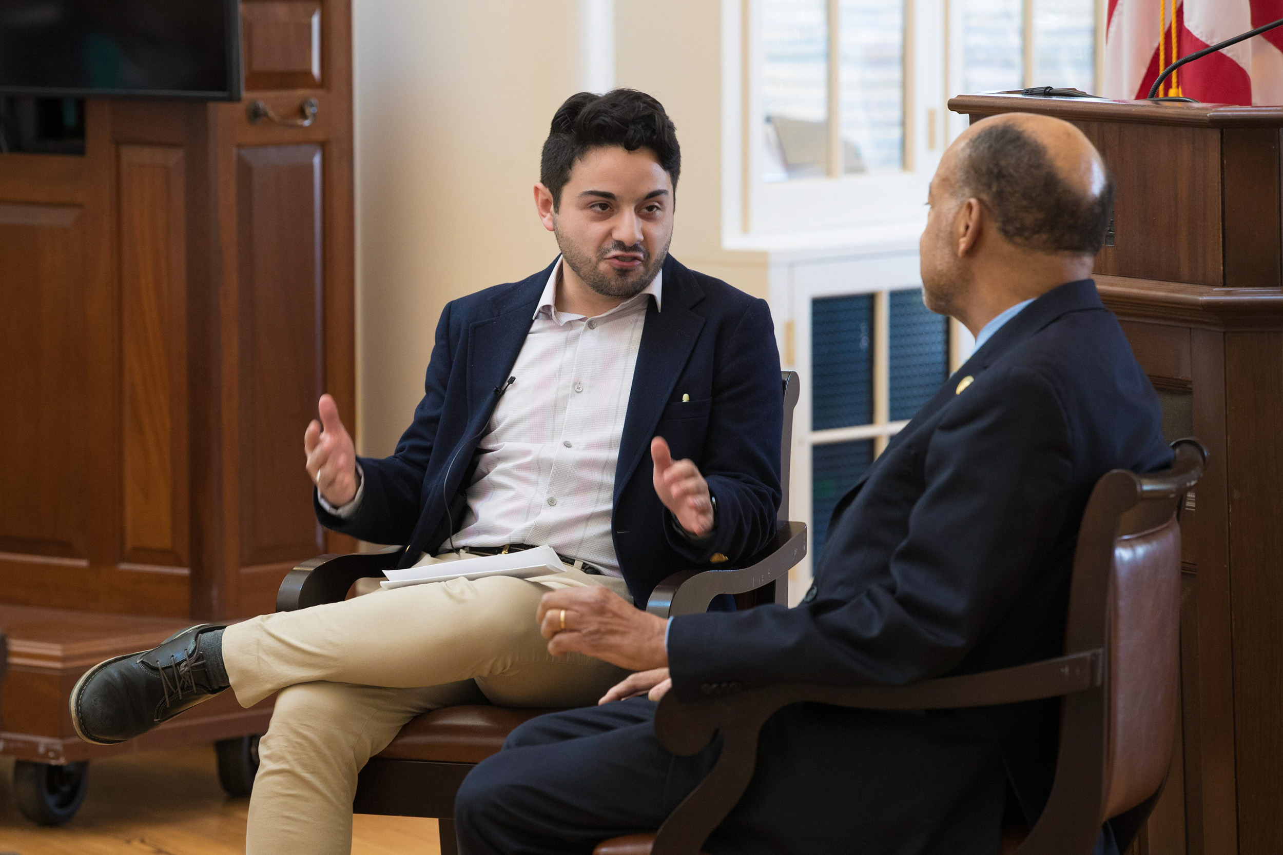 Alex Cintron sitting with Roebuck in the Rotunda during a presentation 