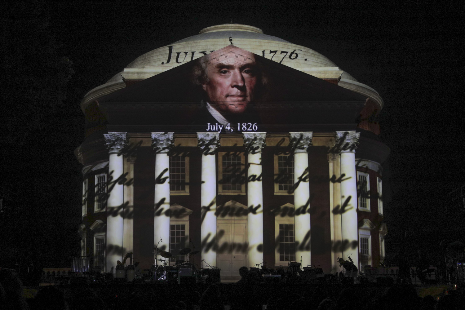 Headshot of Thomas Jefferson and handwritten document projected onto the Rotunda