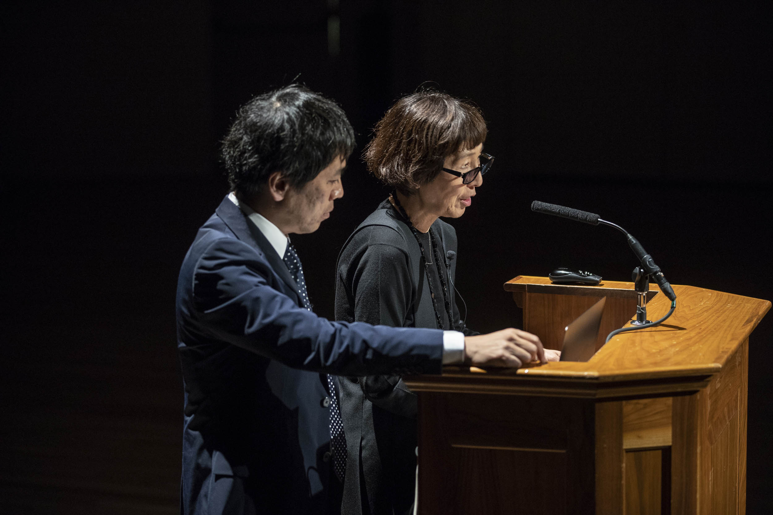 Kazuyo Sejima and Ryue Nishizawa speaking at a podium