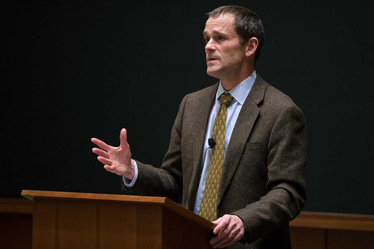 President Jim Ryan standing at a podium giving a speech