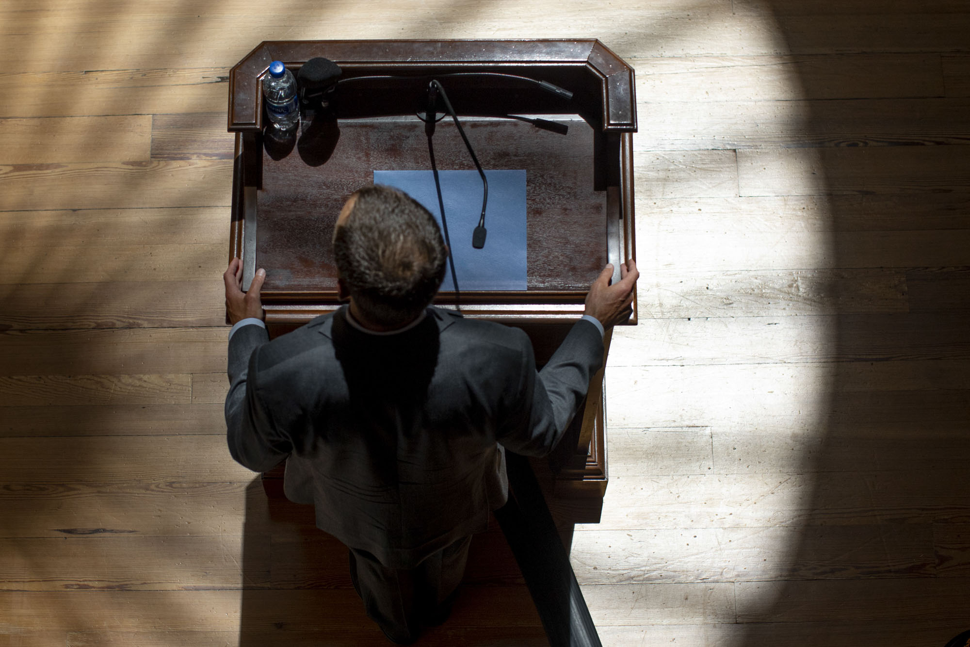 Aerial view of Jim Ryan standing at a podium giving a speech