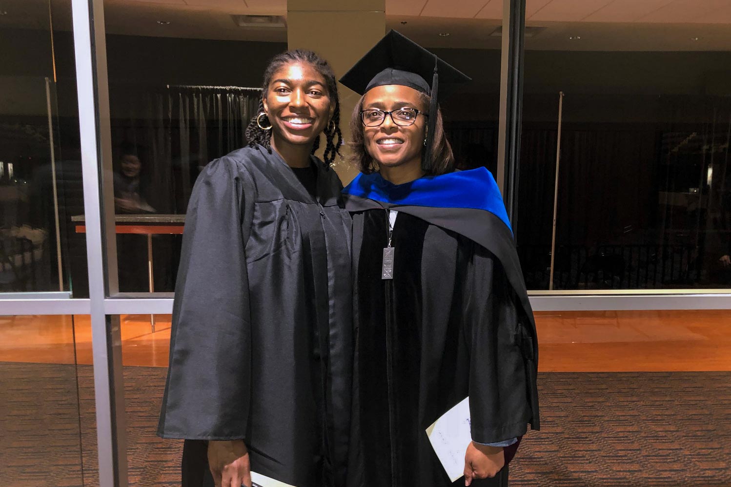 Willoughby, left, and Carla Williams stand together at graduation