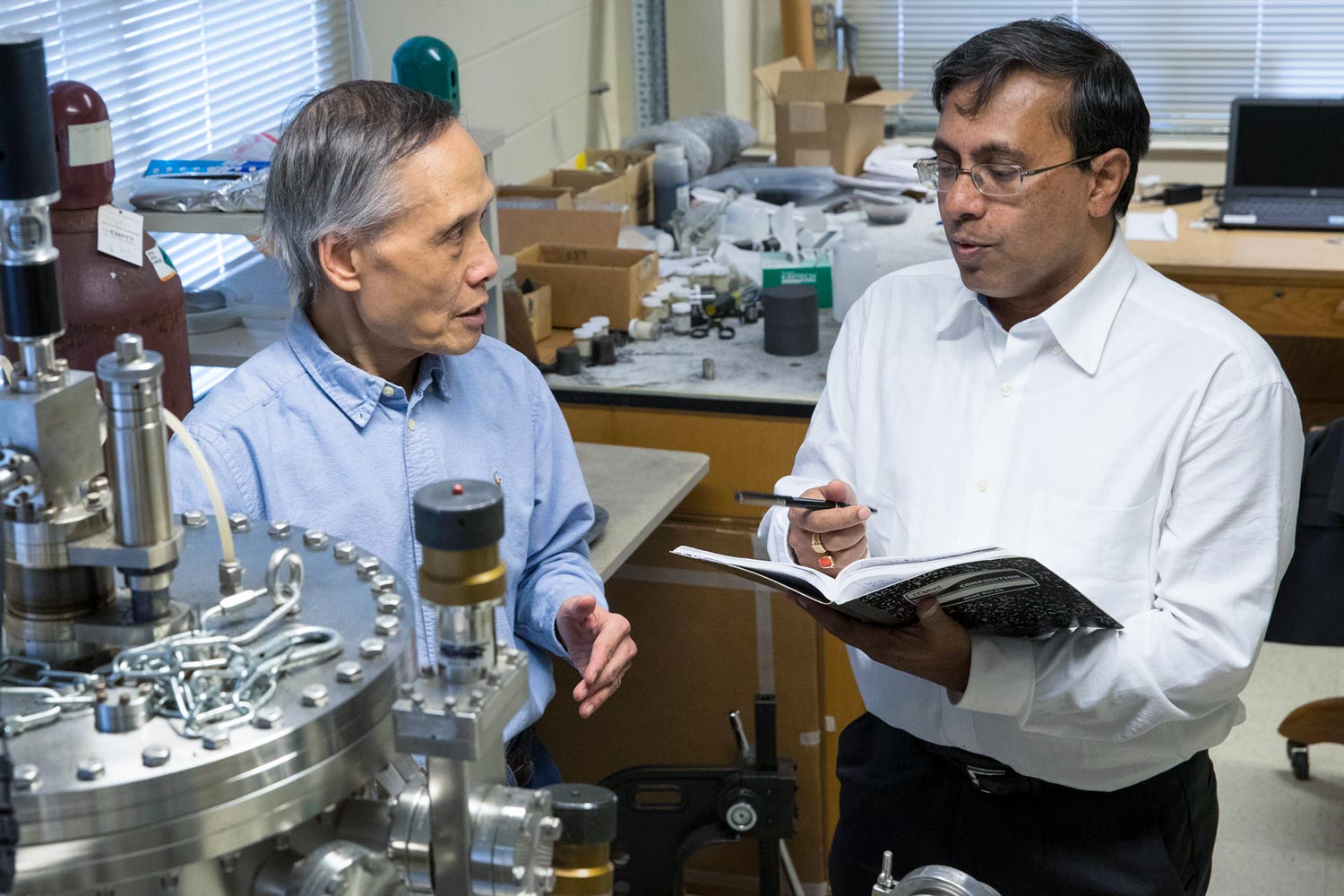 Joseph Poon, left, and Avik Ghosh, talking together