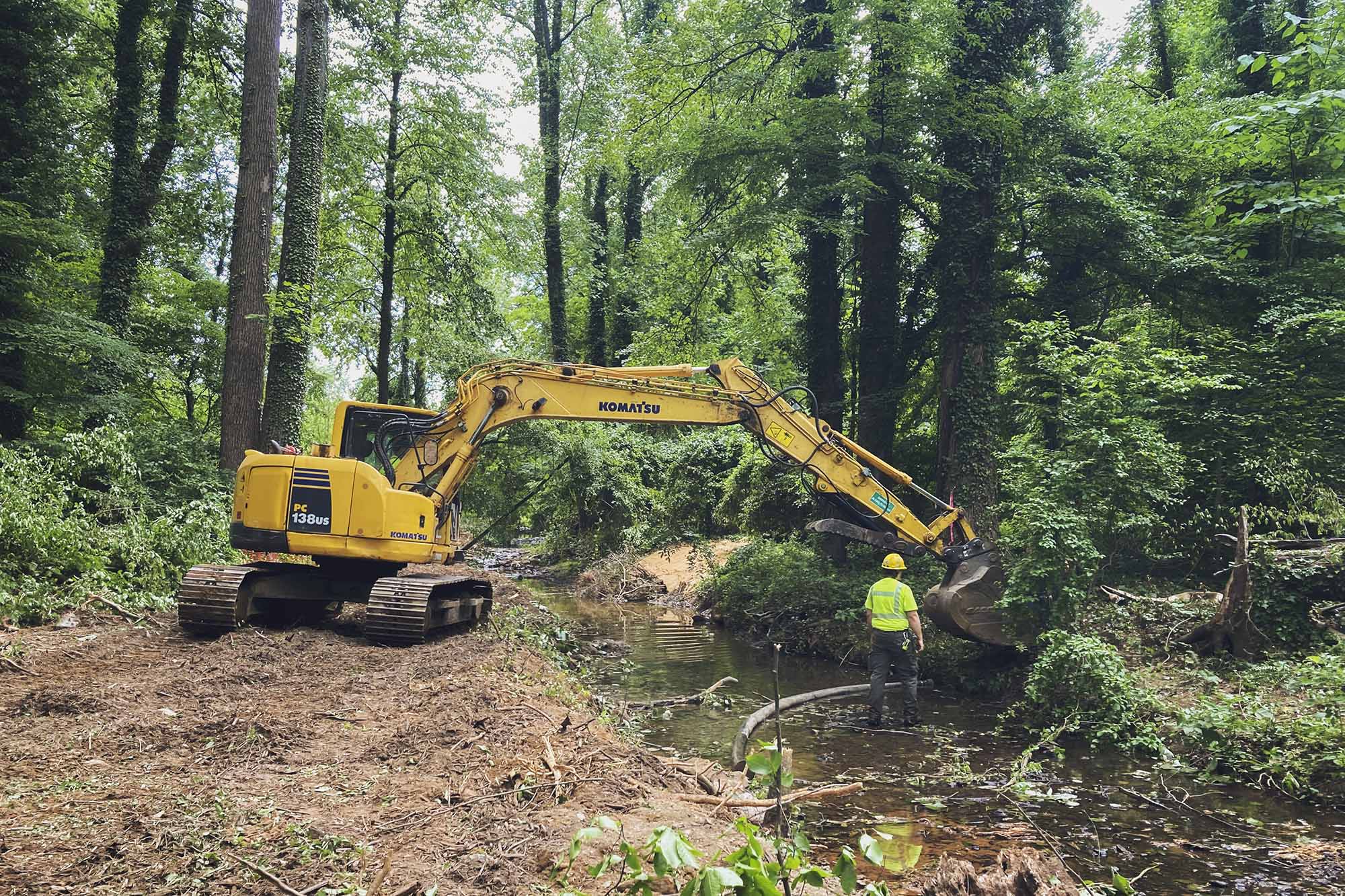 Backhoe working on the bank of stream for preservation